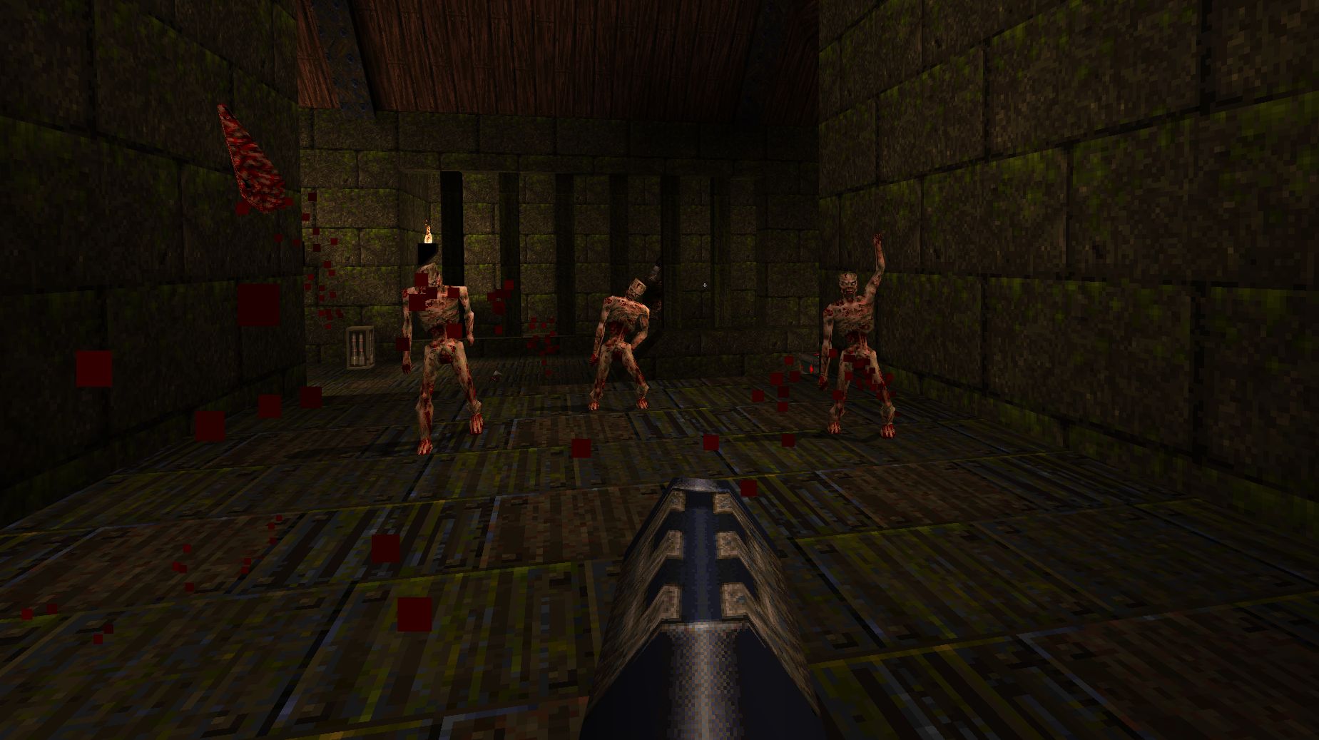 Three zombies approach the player in Quake