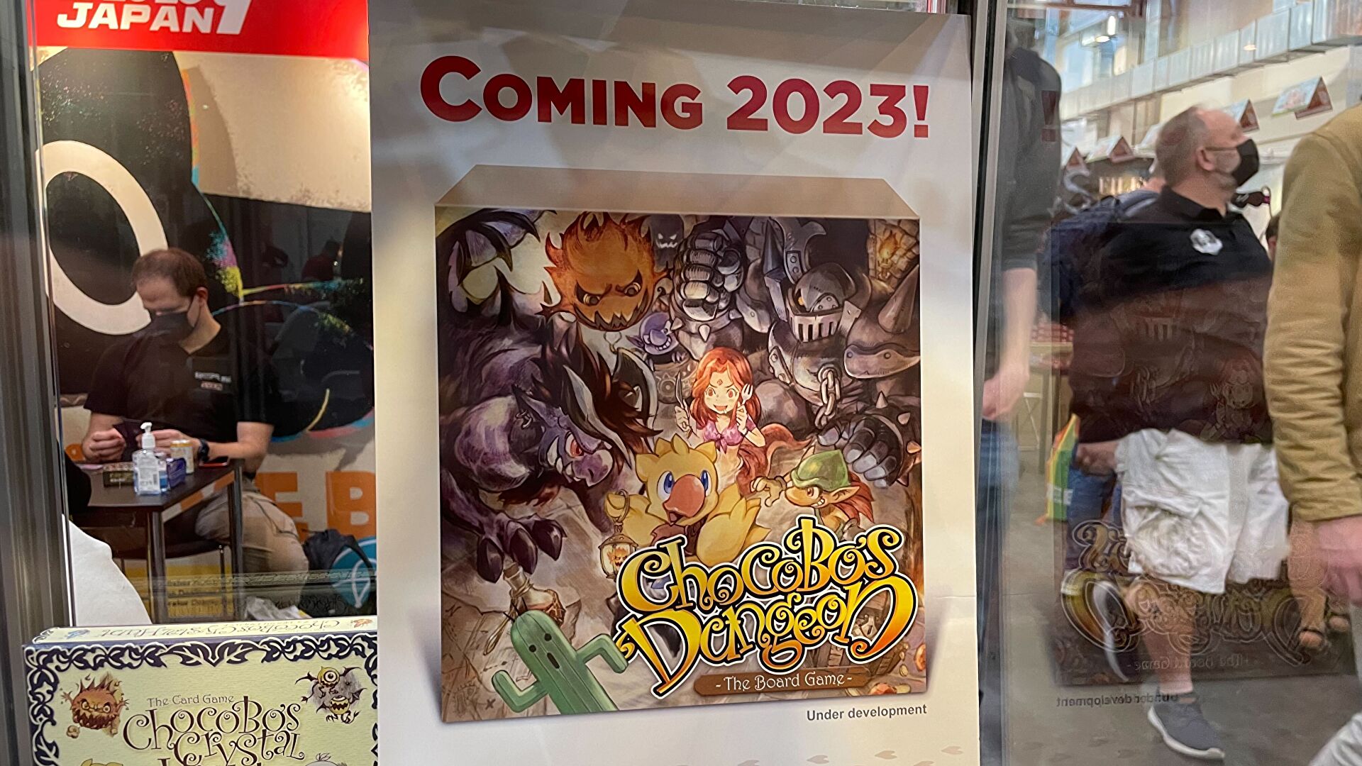 A sign advertising an in-development Chocobo Dungeon board game as seen at Essen Spiel.