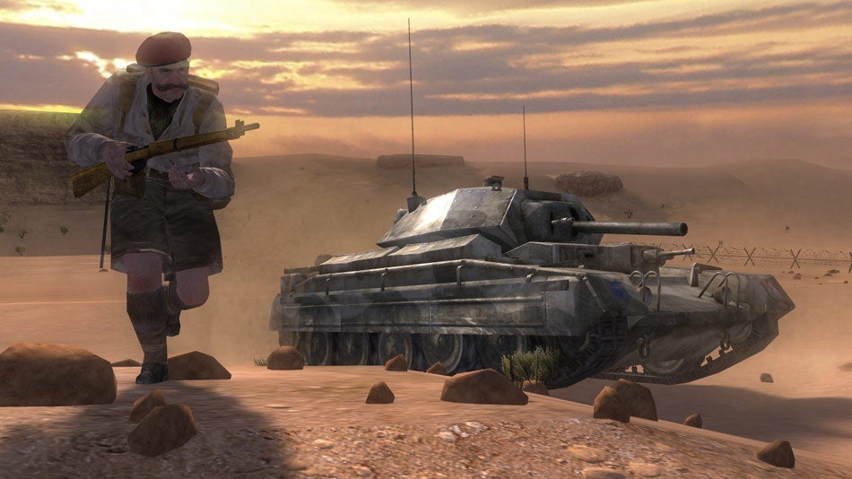 A man with a big moustache and shorts runs across a desert in front of a tank in Call Of Duty 2