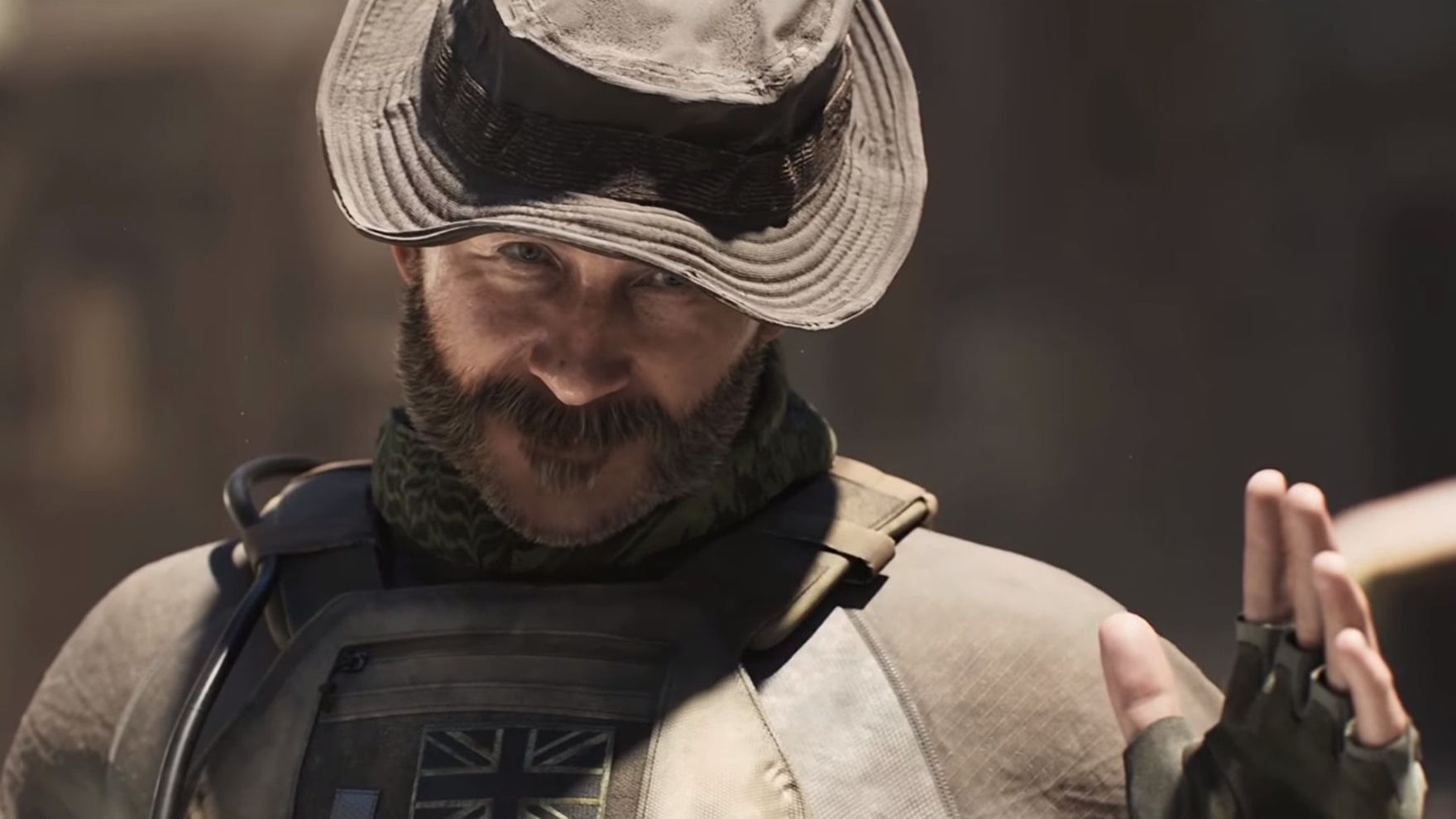 A bearded man in a hat raises his hand in greeting in Call Of Duty Modern Warfare