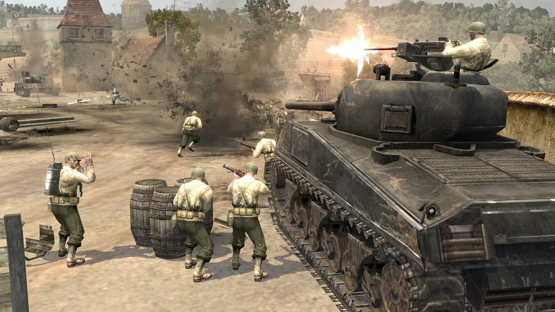 Soldiers stand next to a tank in Company Of Heroes