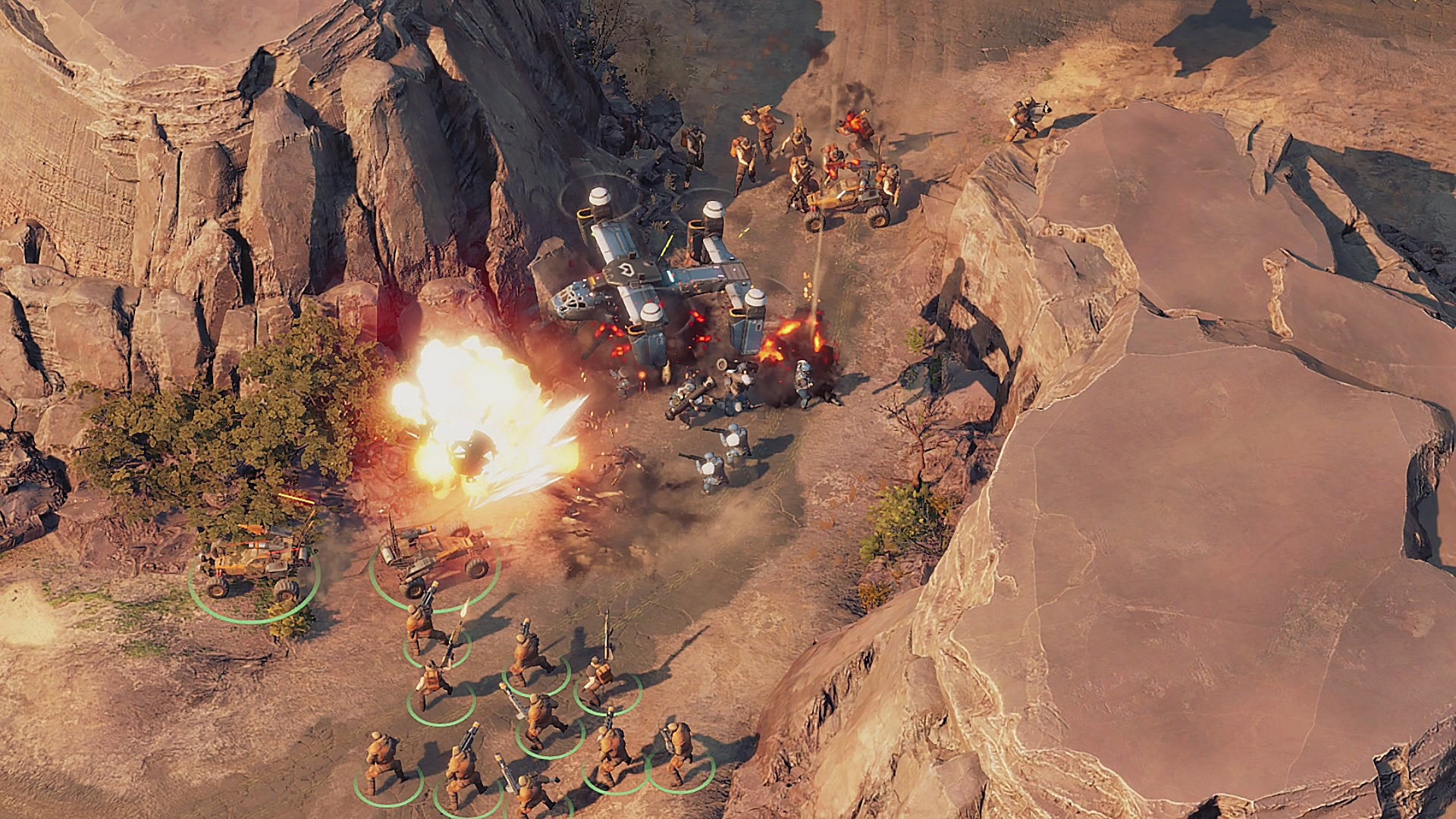 Two armies fight in a desert canyon while dodging helicopter fire in Crossfire: Legion