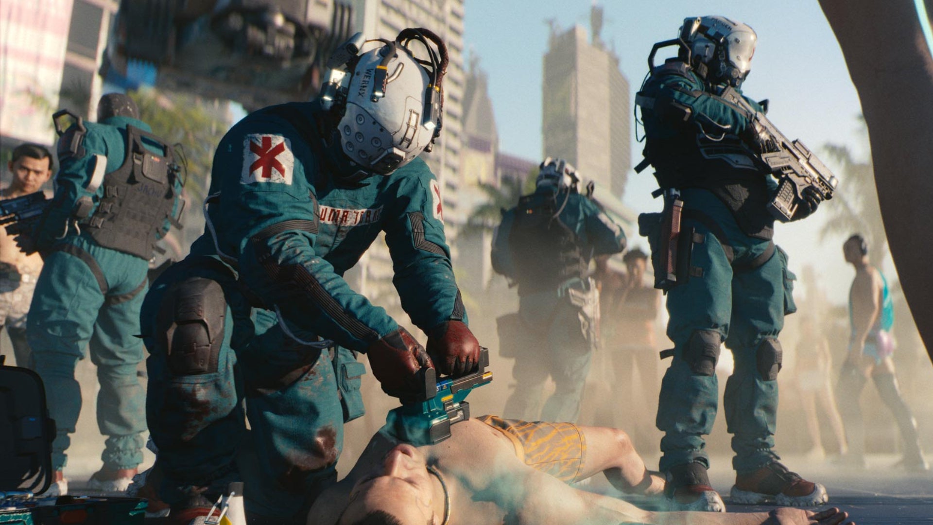 A trauma team in Cyberpunk 2077 works to revive an unconscious citizen of Night City.