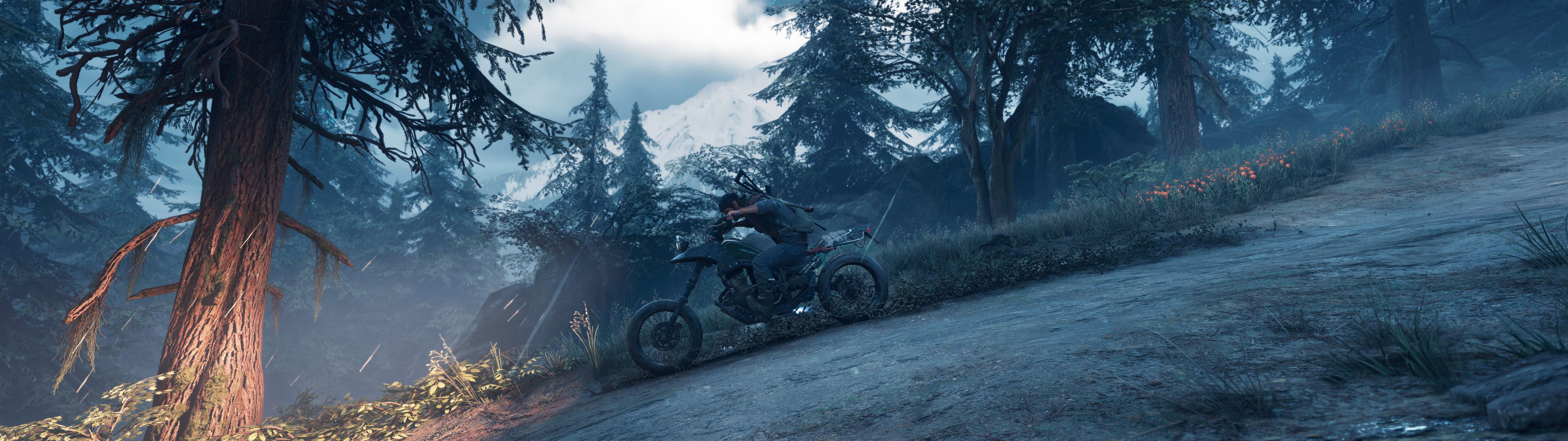 A screenshot of Deacon riding downhill on his motorcycle in Days Gone