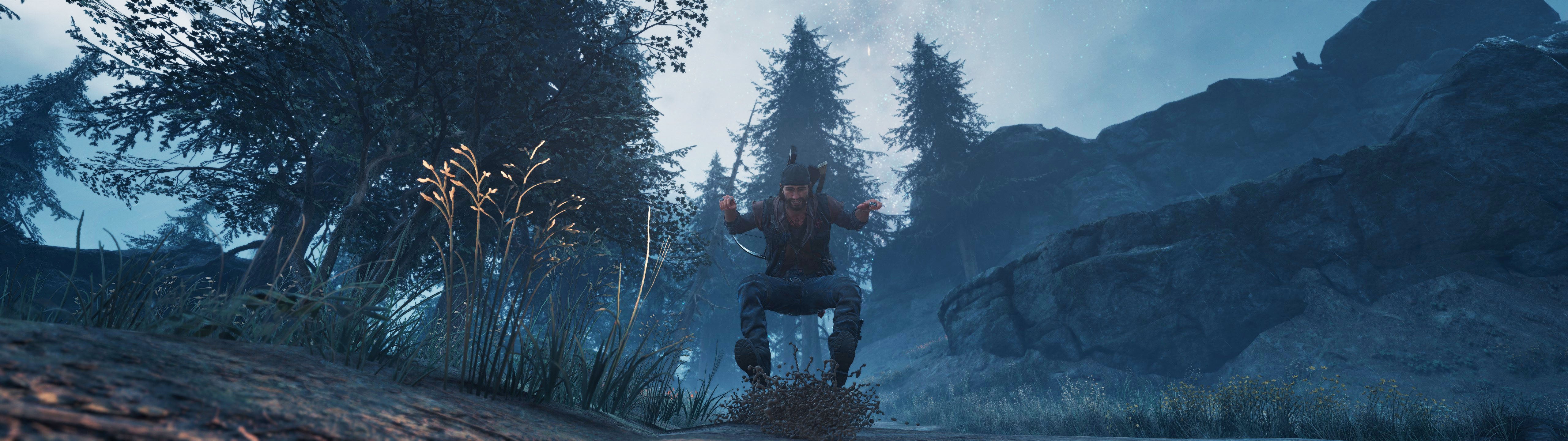 A screenshot of Deacon riding downhill on his motorcycle in Days Gone