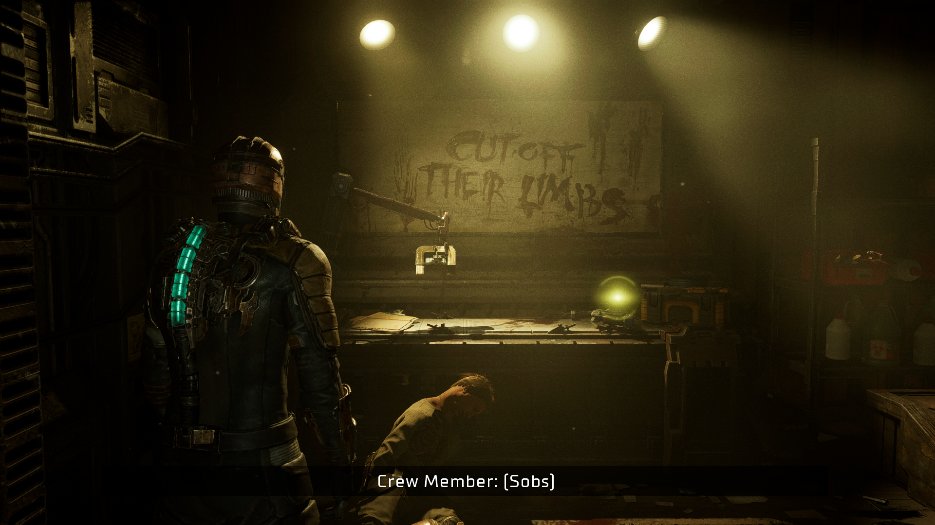 Isaac look at some graffiti in Dead Space