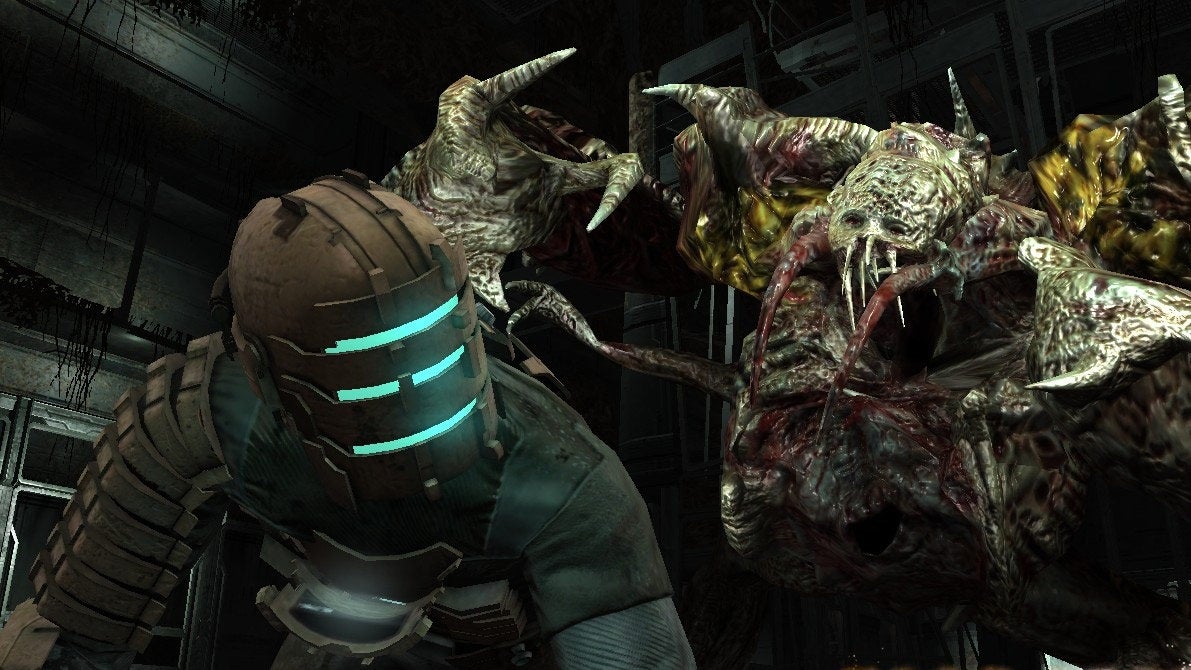 A man cowers from an ugly evil monster alien in Dead Space.