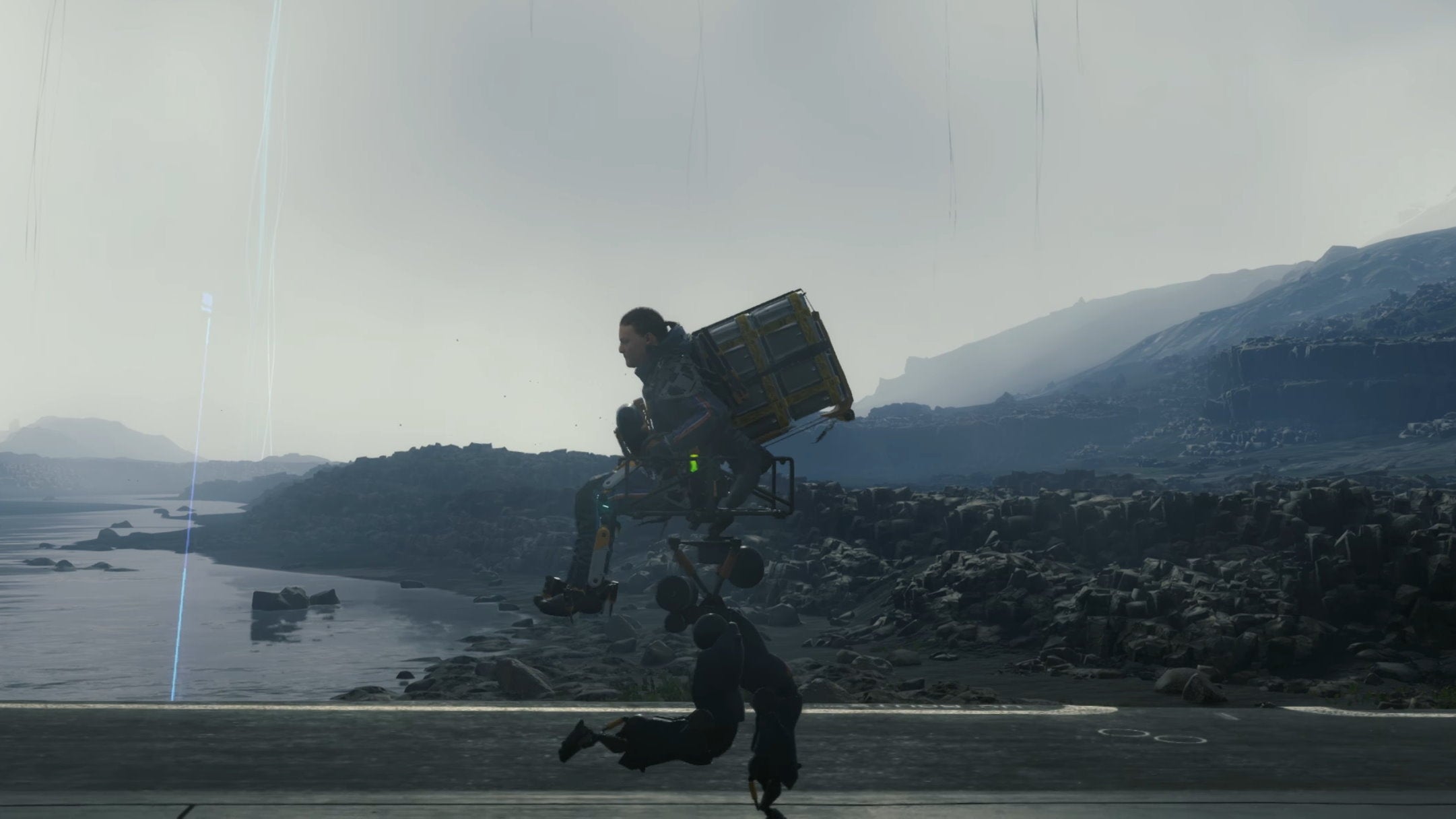 Sam Bridges is being carried by a buddy bot in Death Stranding's Director's Cut