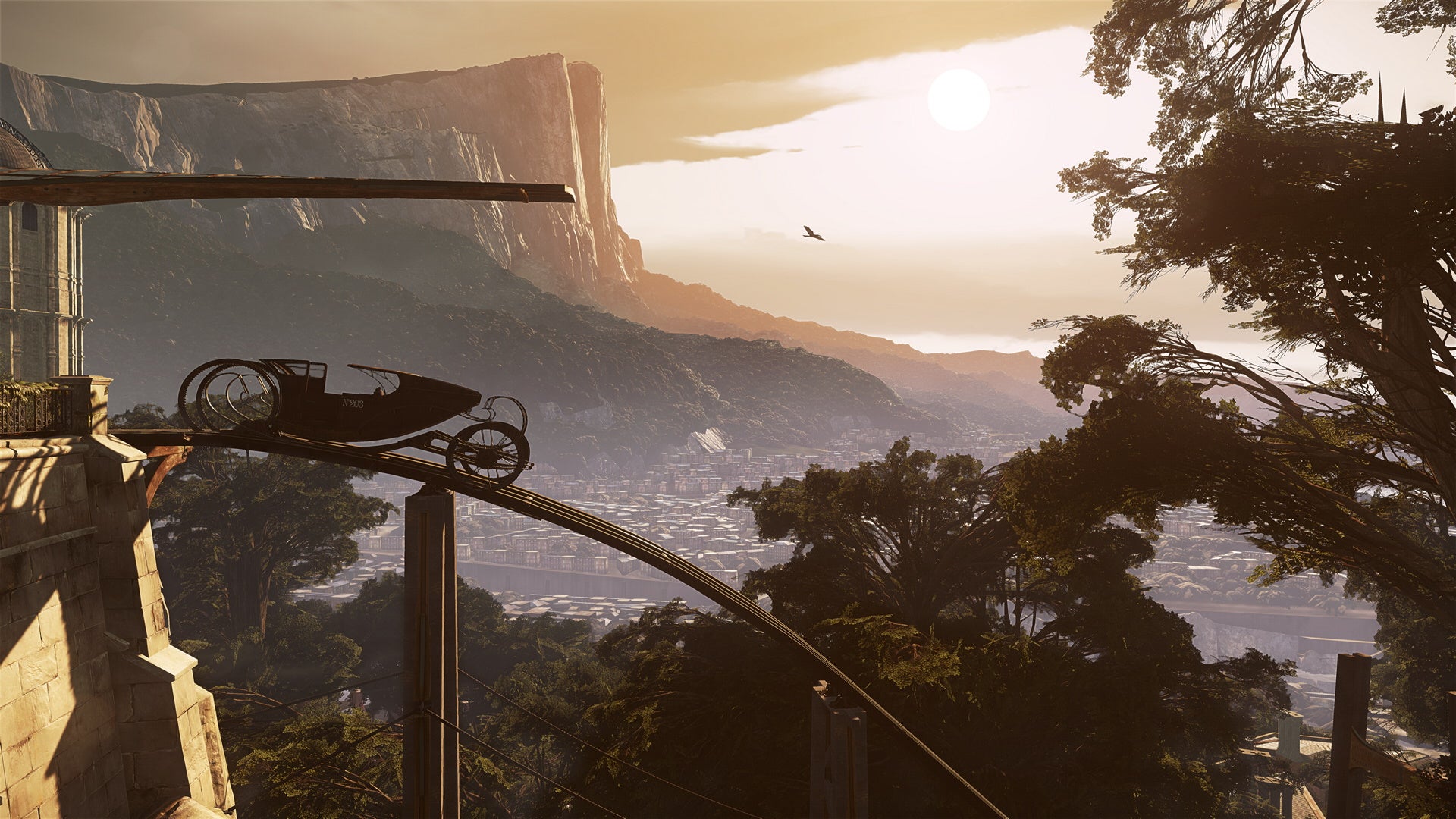 An image of Dishonored 2, which shows a view of Karnaca at sunset. A rail car is parked to the left and out in the distance the city rests below forests and cliffs.