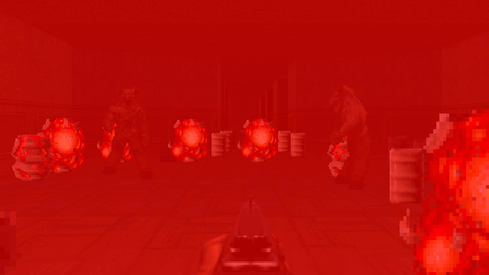 Dying in a rain of explosive barrels in a Doom 2 screenshot.