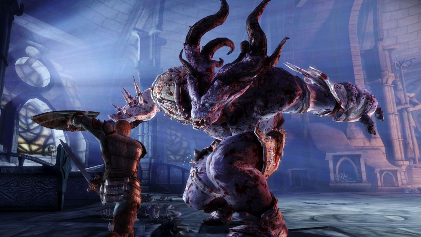 The Grey Warden in Dragon Age: Origins fights a giant darkspawn ogre