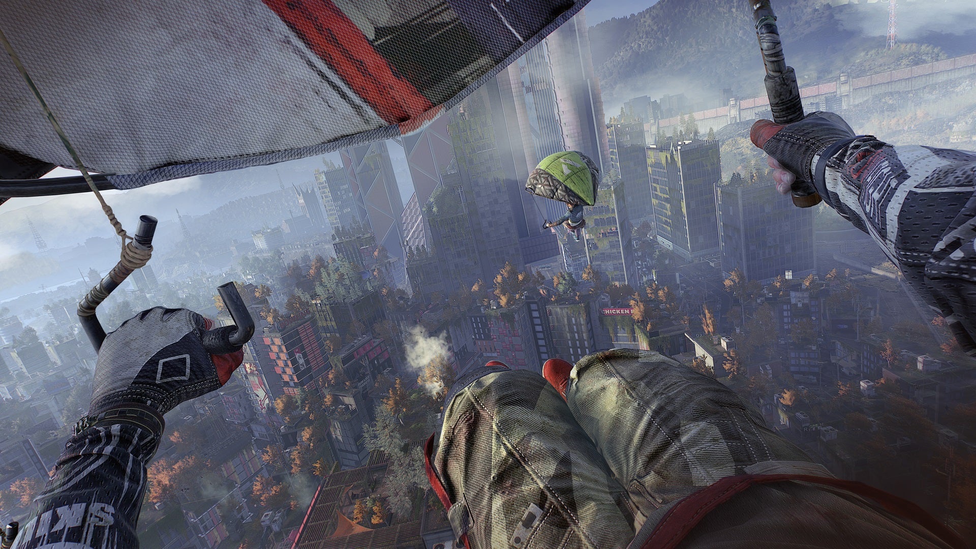First-person hang-gliding over the city in Dying Light 2.