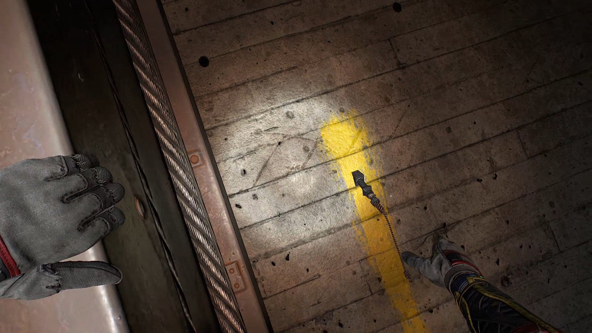 The player reaches for the Grappling Hook tool embedded in a wall in Dying Light 2.