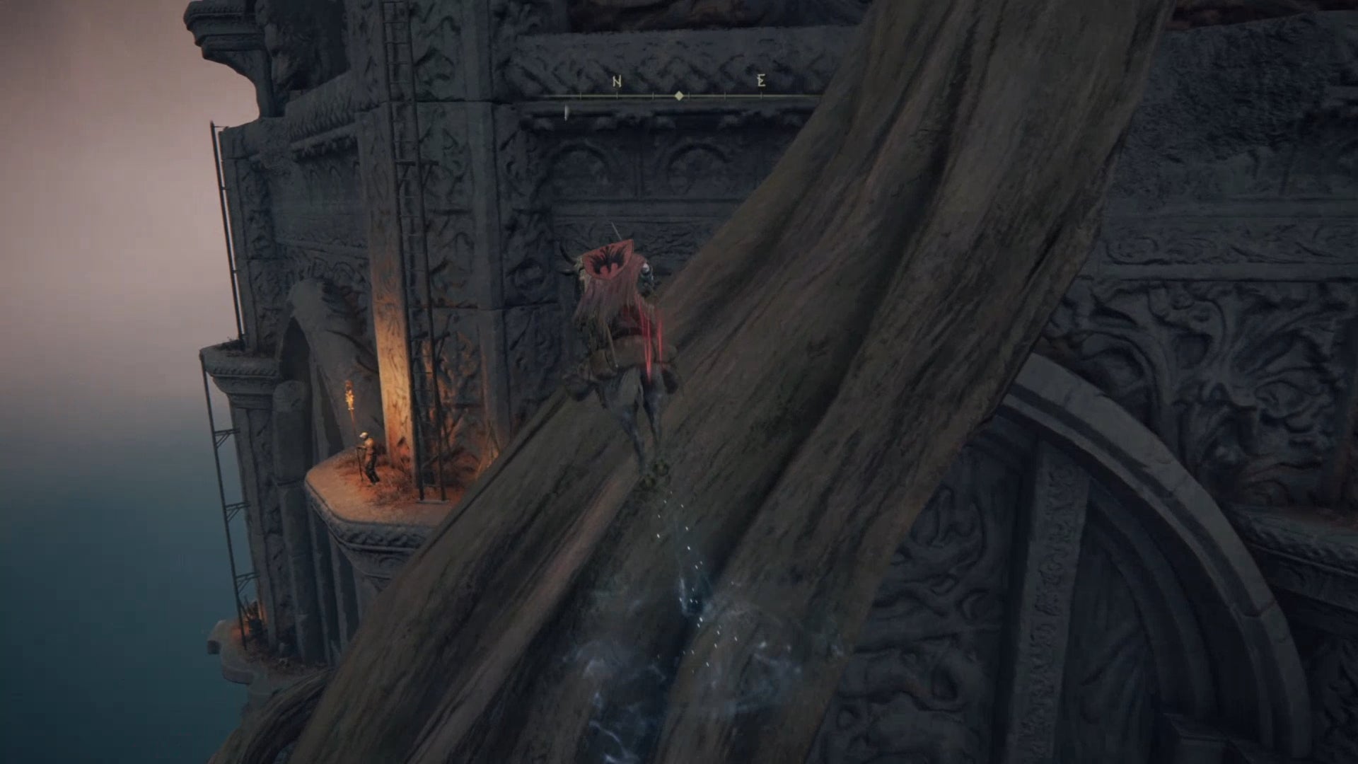 Elden Ring: the player uses the horse Torrent and a nearby branch to reach a ledge on the outside of the Divine Tower of Caelid.