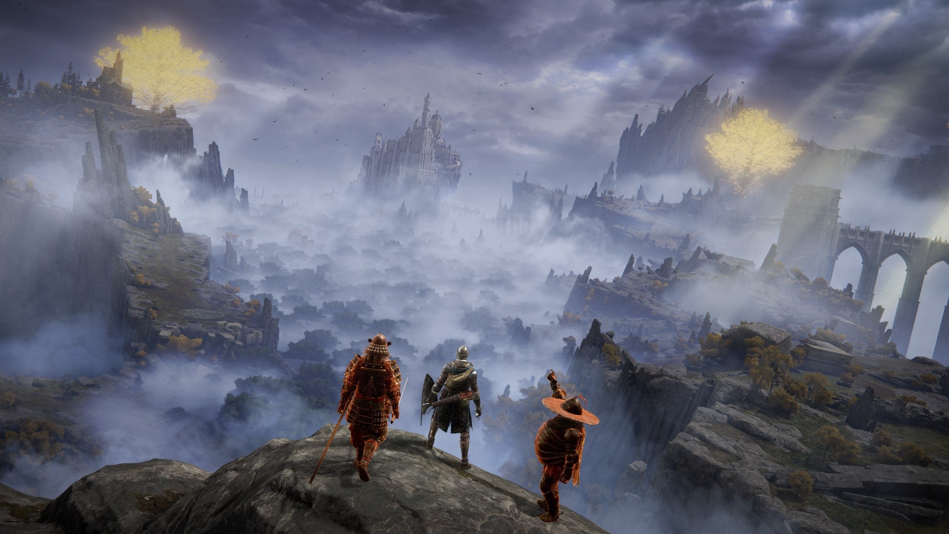 Three players stand on the edge of a cliff and look out over Limgrave in Elden Ring.