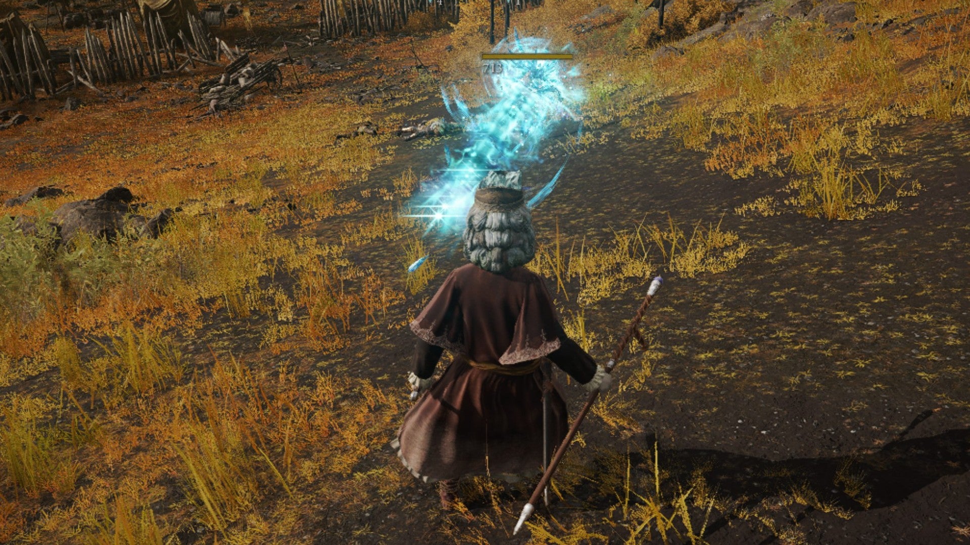 Elden Ring sorcerer blasting a comet at an enemy on a hill