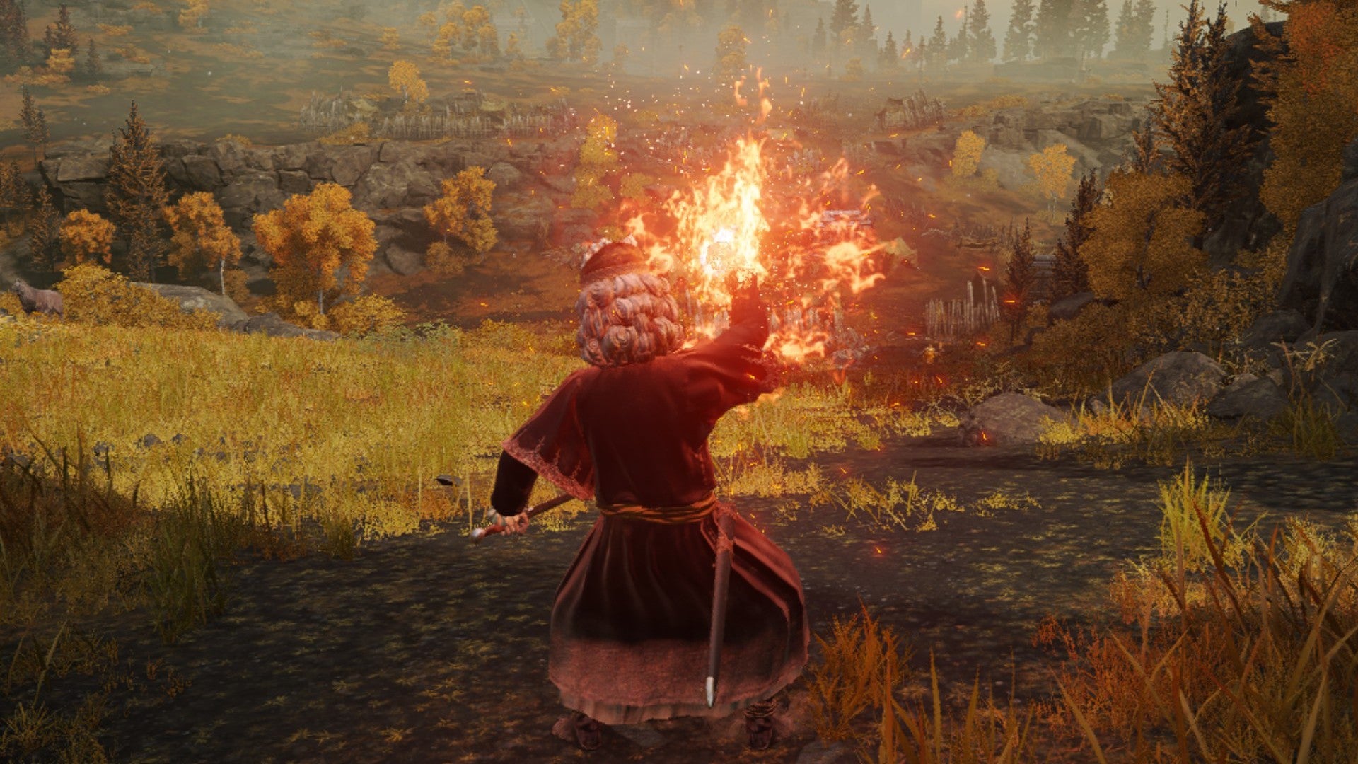 Elden ring player casting Flame Sling on a hill basked in sun