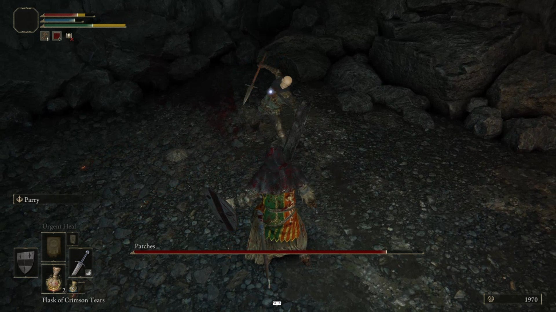 A fight between the player and the miniboss Patches in Elden Ring.