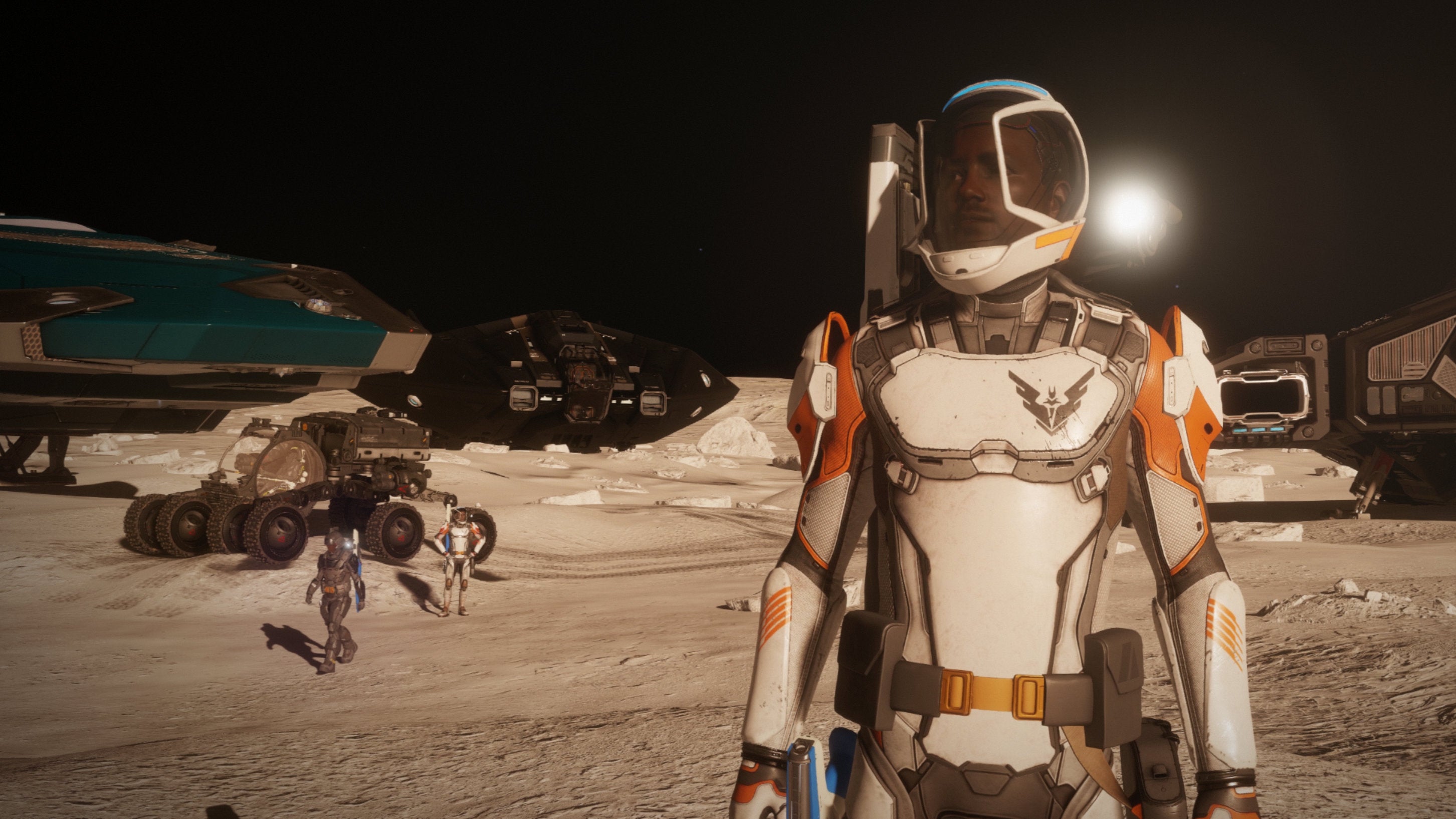 People standing on a moon in an Elite Dangerous: Odyssey screenshot.