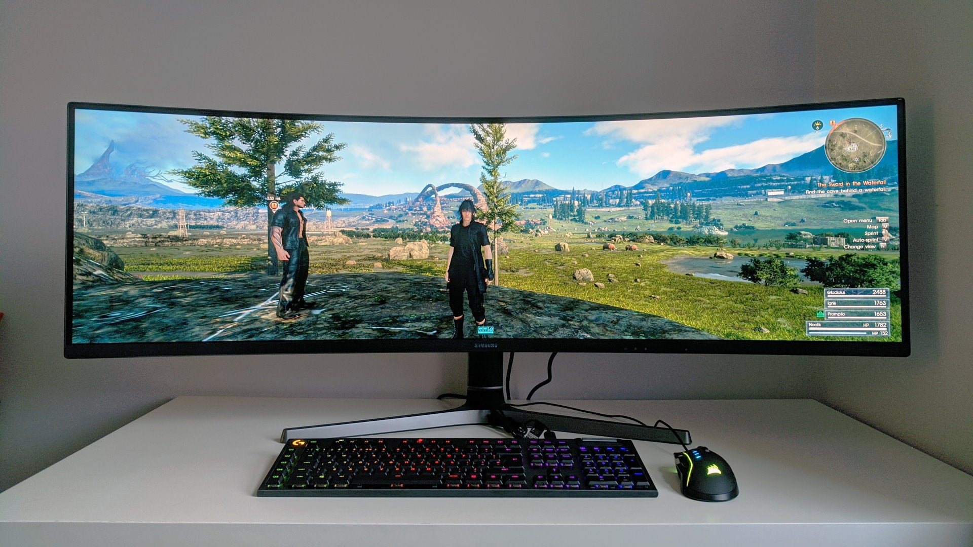 A photo of an ultrawide gaming monitor running Final Fantasy XV
