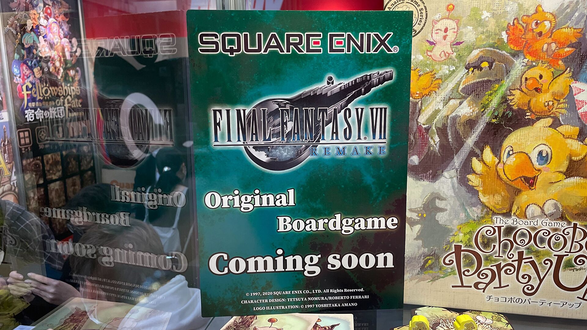 A photo of a sign at Essen Spiel saying that a Final Fantasy VII Remake original boardgame is "coming soon".