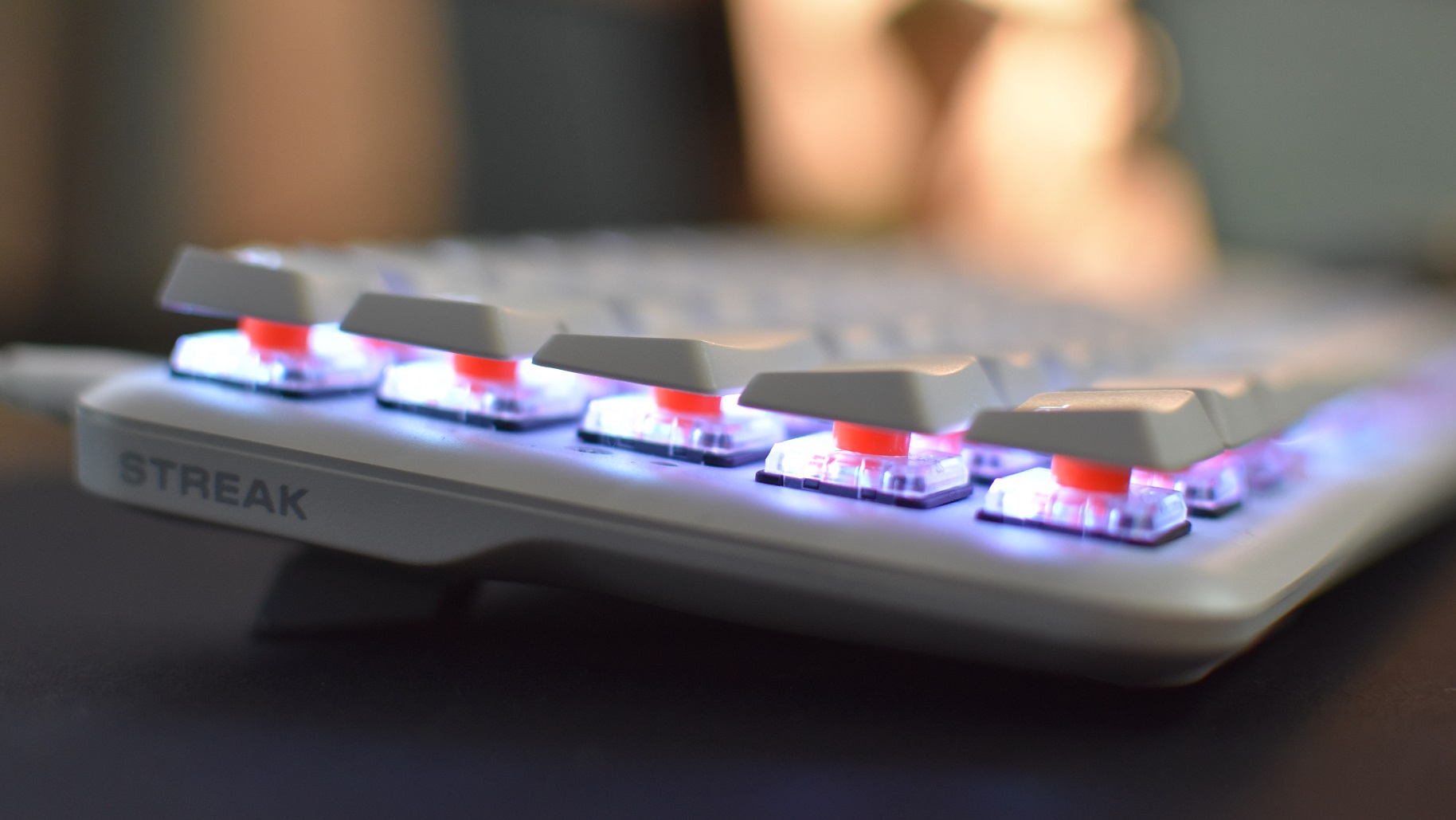A side view of the Fnatic Streak65 LP gaming keyboard, showing its low-profile mechanical switches.