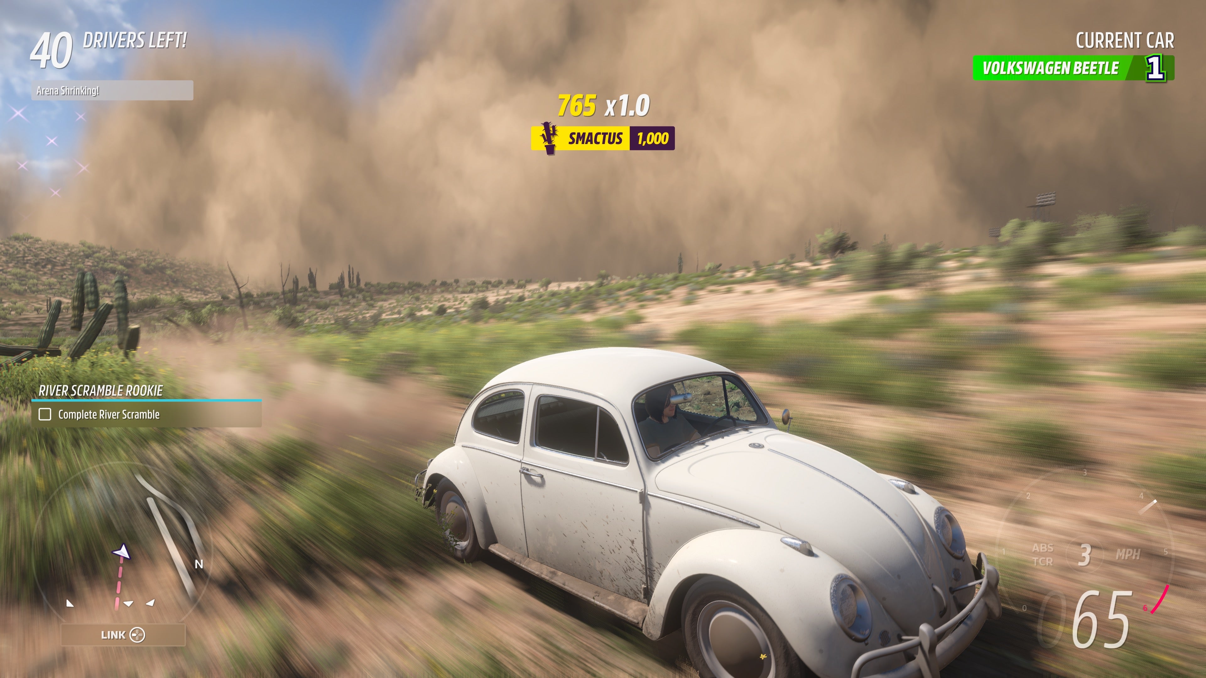 A car escapes a large dust cloud in Forza Horizon 5