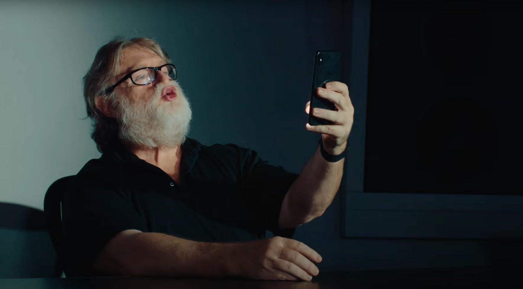 Gabe Newell takes a selfie in an advert for a Dota 2 Cave Johnson announcer pack.