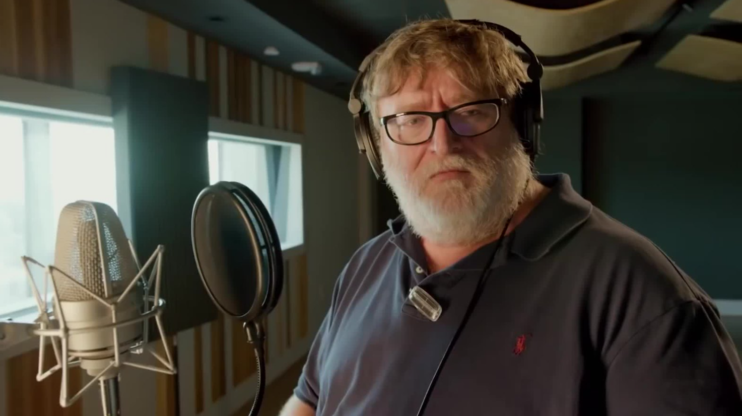 Gabe Newell in a recording studio, standing next to a microphone.