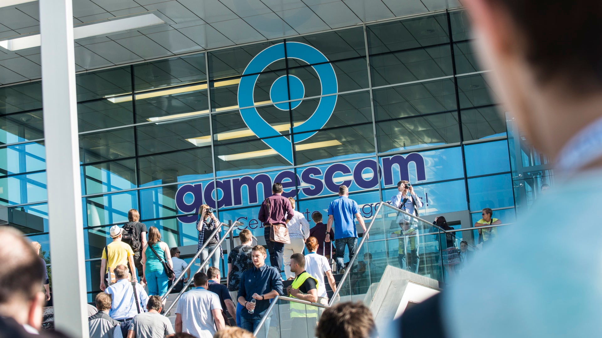 The exterior of the Kolnmesse convention centre showing the Gamescom logo in the window