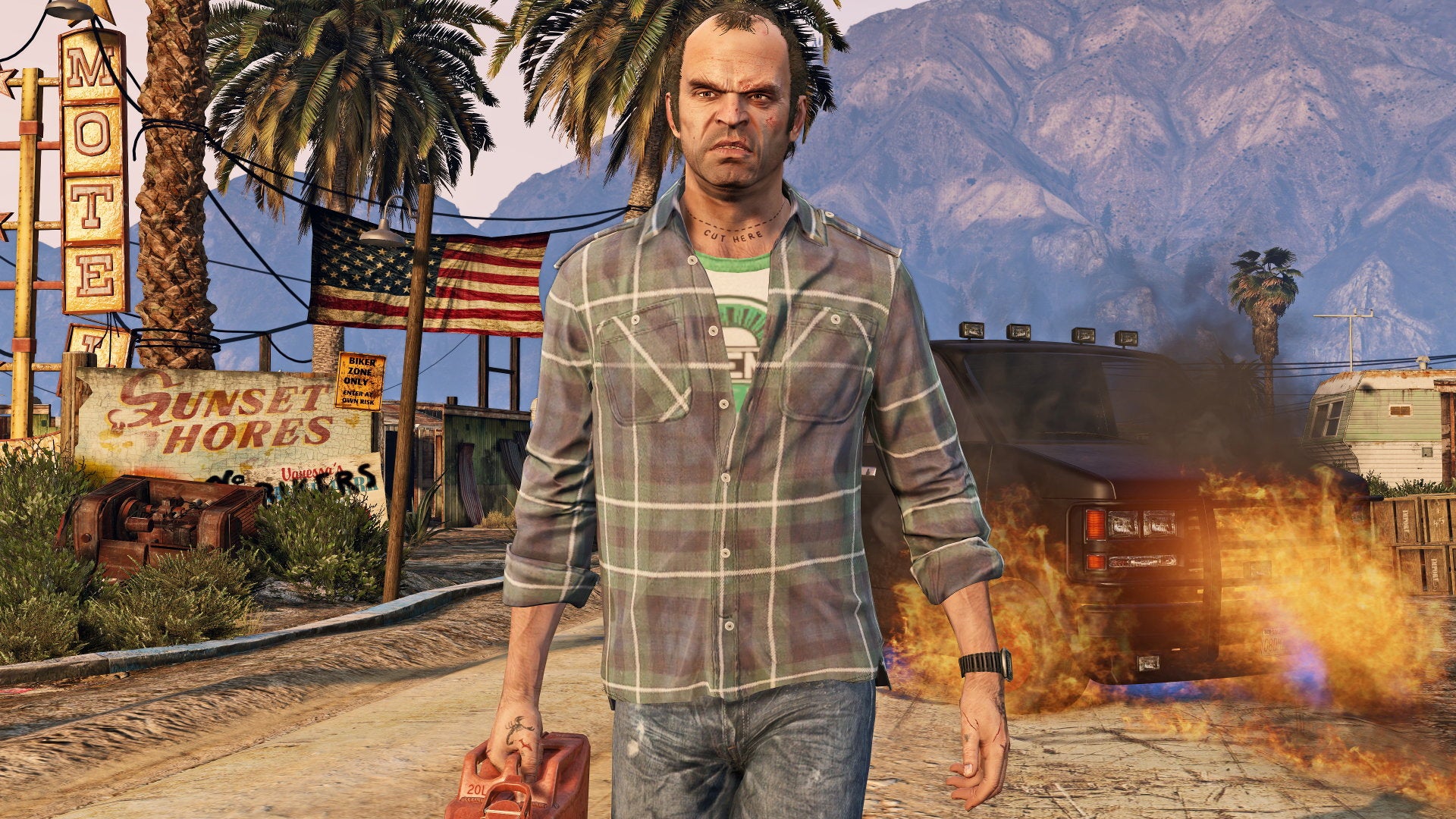 Trevor walking away from a fire with a can of petrol in a Grand Theft Auto V screenshot.