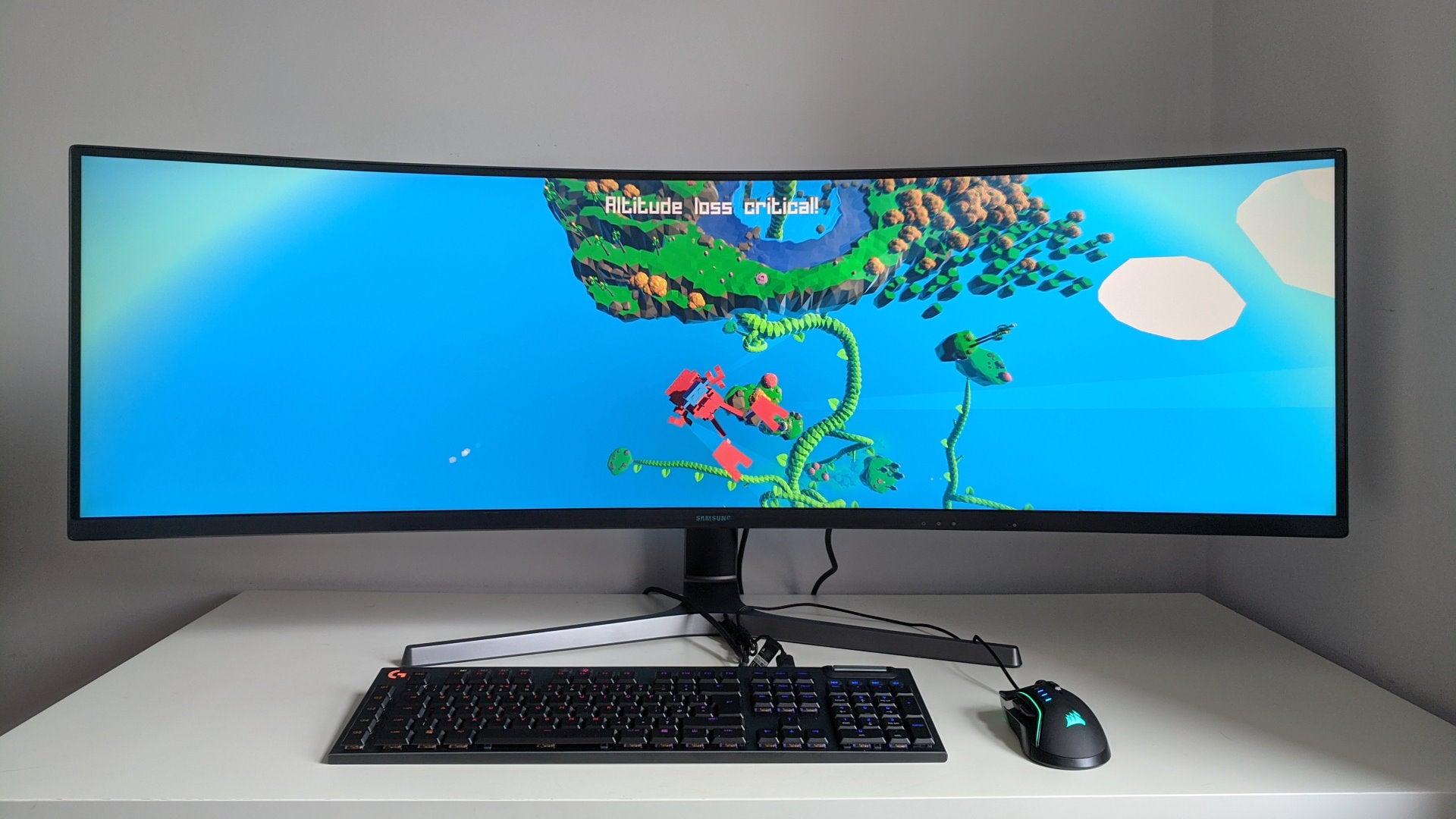 A photo of an ultrawide gaming monitor running Grow Home