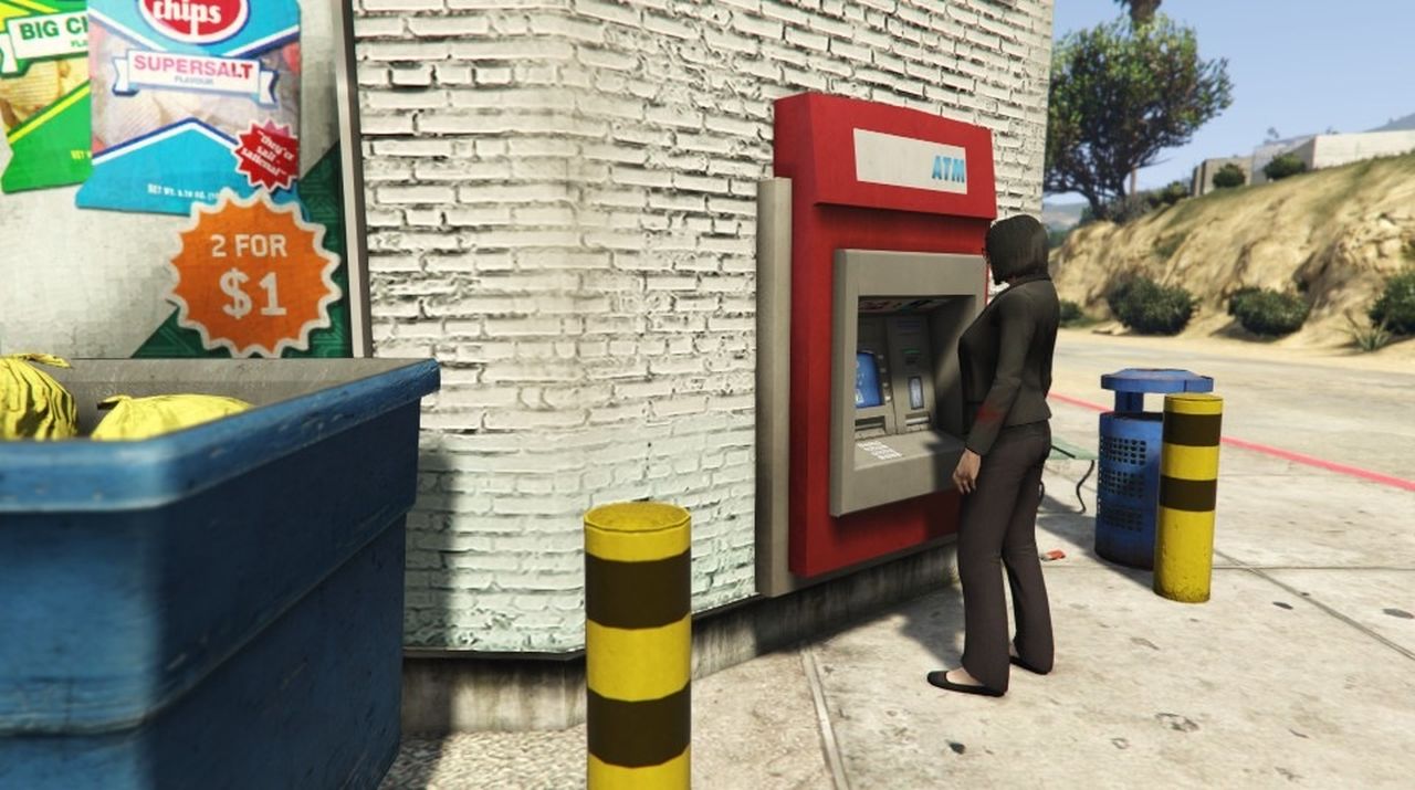 The player character uploads money at an ATM in GTA Online