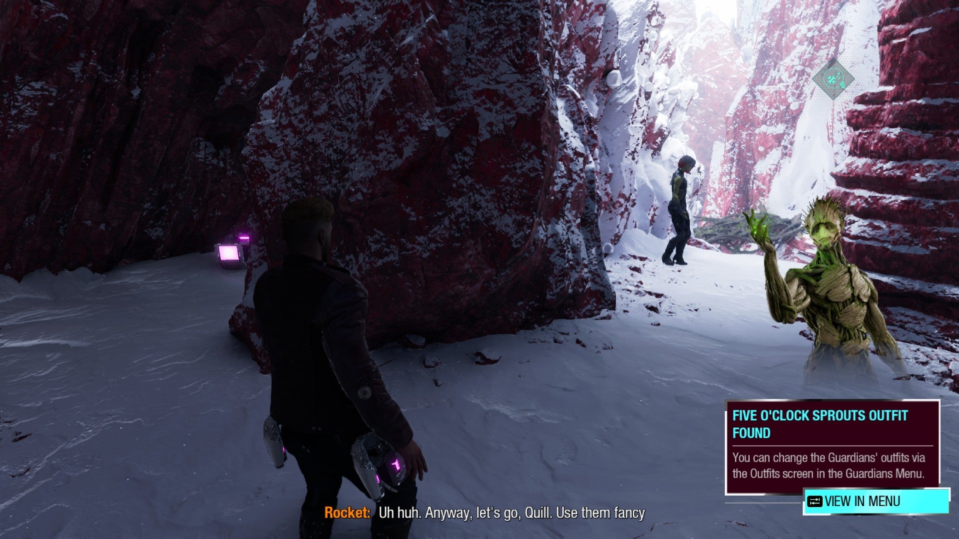 Star-Lord stands in cave with outfit box on left and Gamora in front