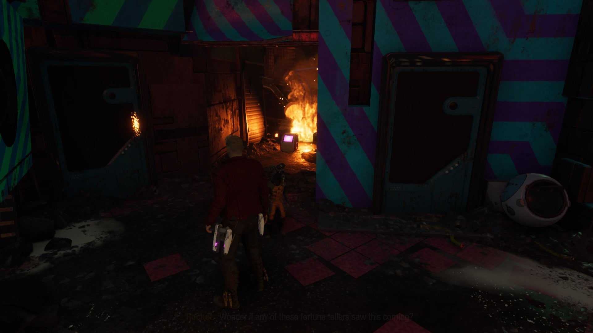 Star-Lord stares into flaming room with outfit box inside. Rocket stands nearby