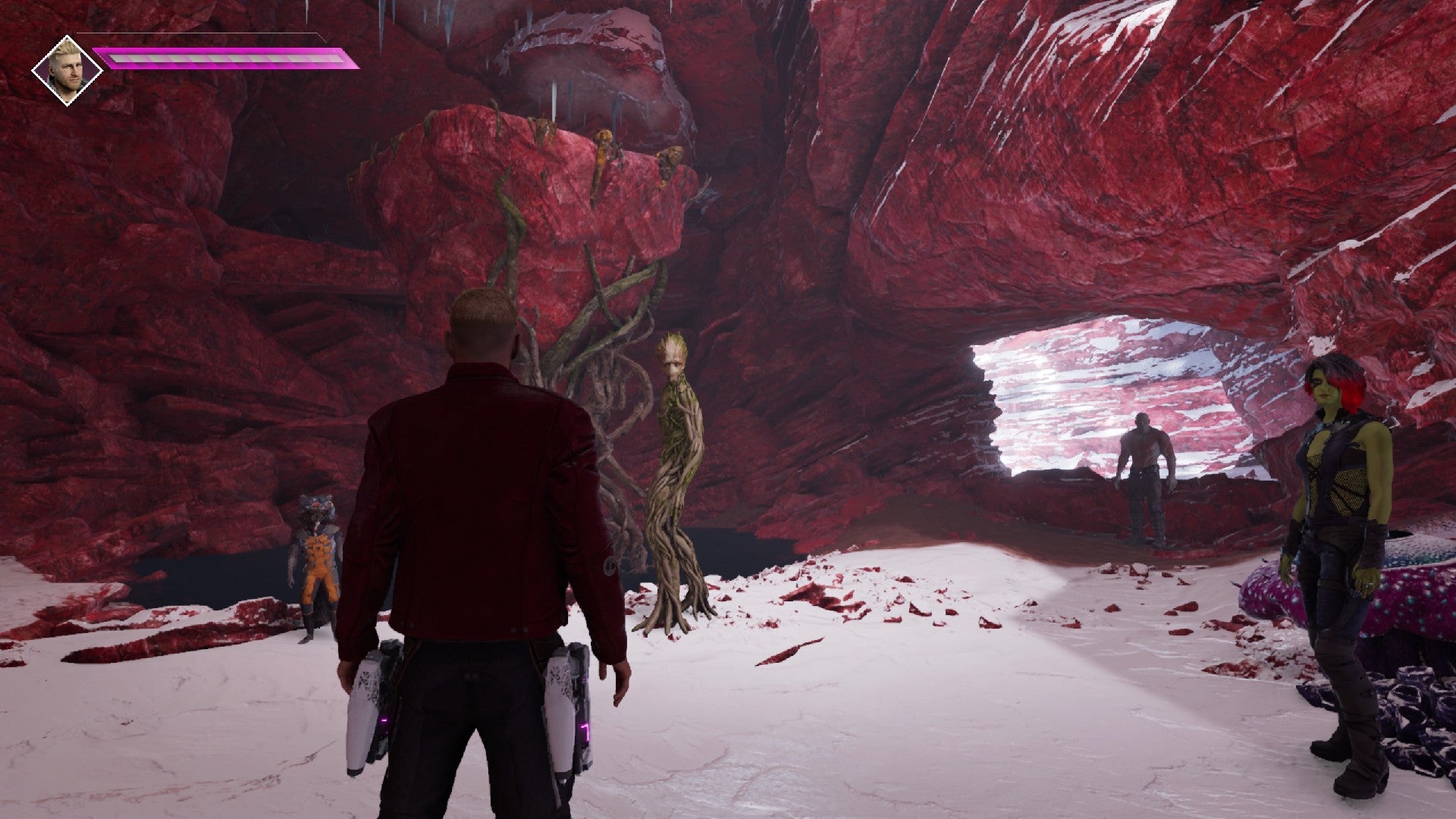 Guardians of the Galaxy stand in cave whilst Groot lifts a platform with his ability