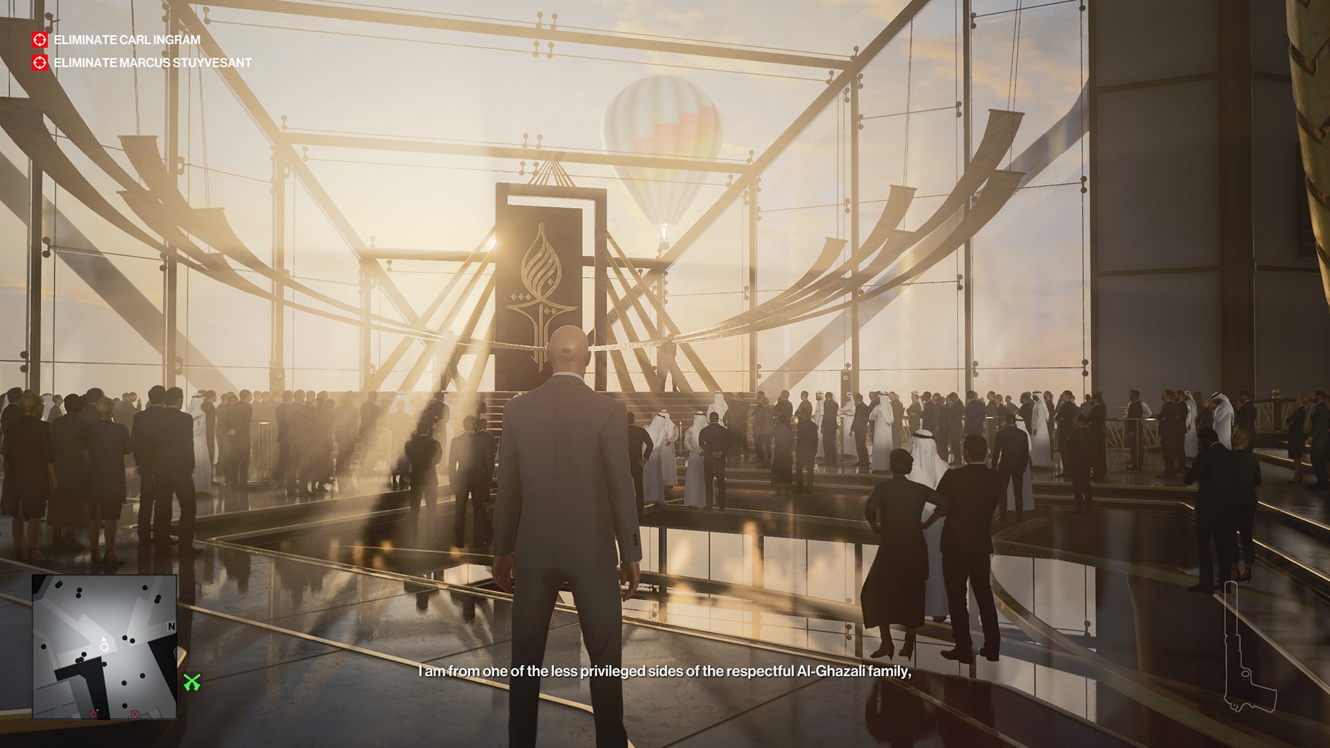 Agent 47 stands discreetly in the main mingling area of the Dubai skyscraper level of Hitman 3. There is a lot of glass and sunlight.