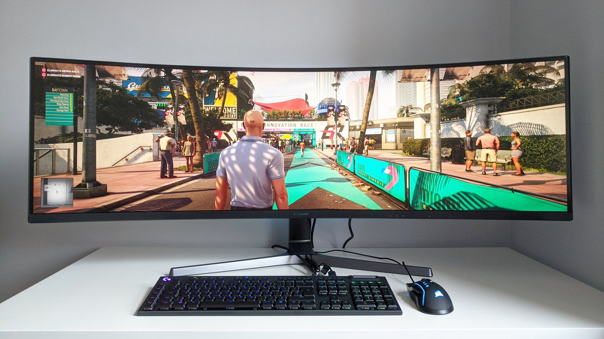 A photo of an ultrawide gaming monitor running Hitman 2