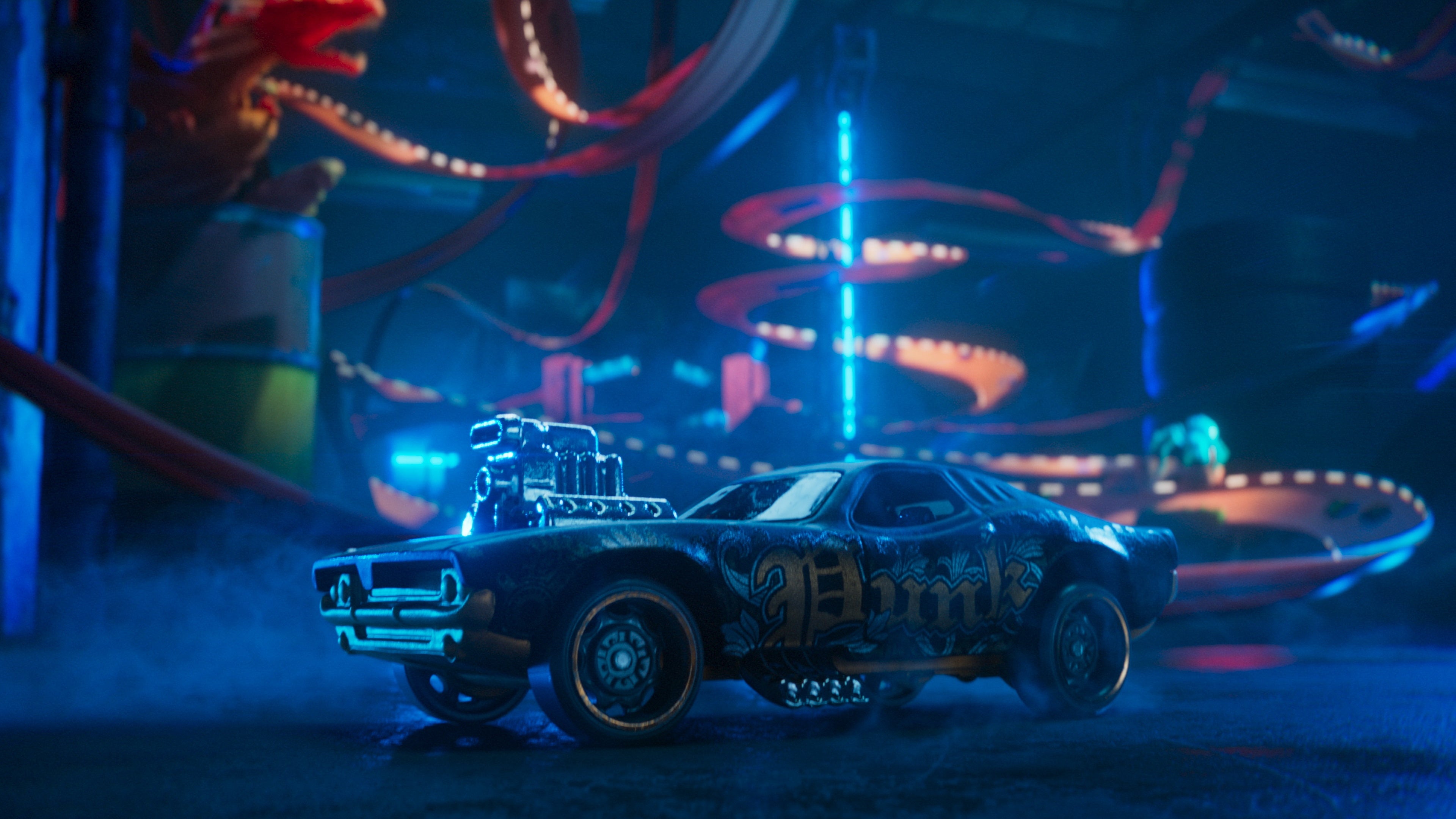 An image of a Hot Wheels Unleashed CG trailer, showing a gnarly car in the foreground and an out-of-focus twisty track in the background.