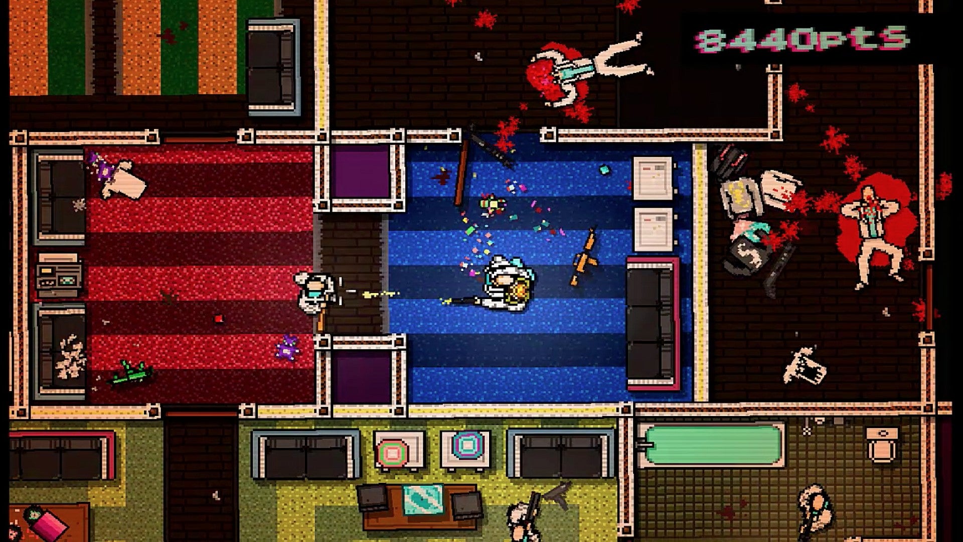 A lounge is covered in gruesome bodies and blood in Hotline Miami