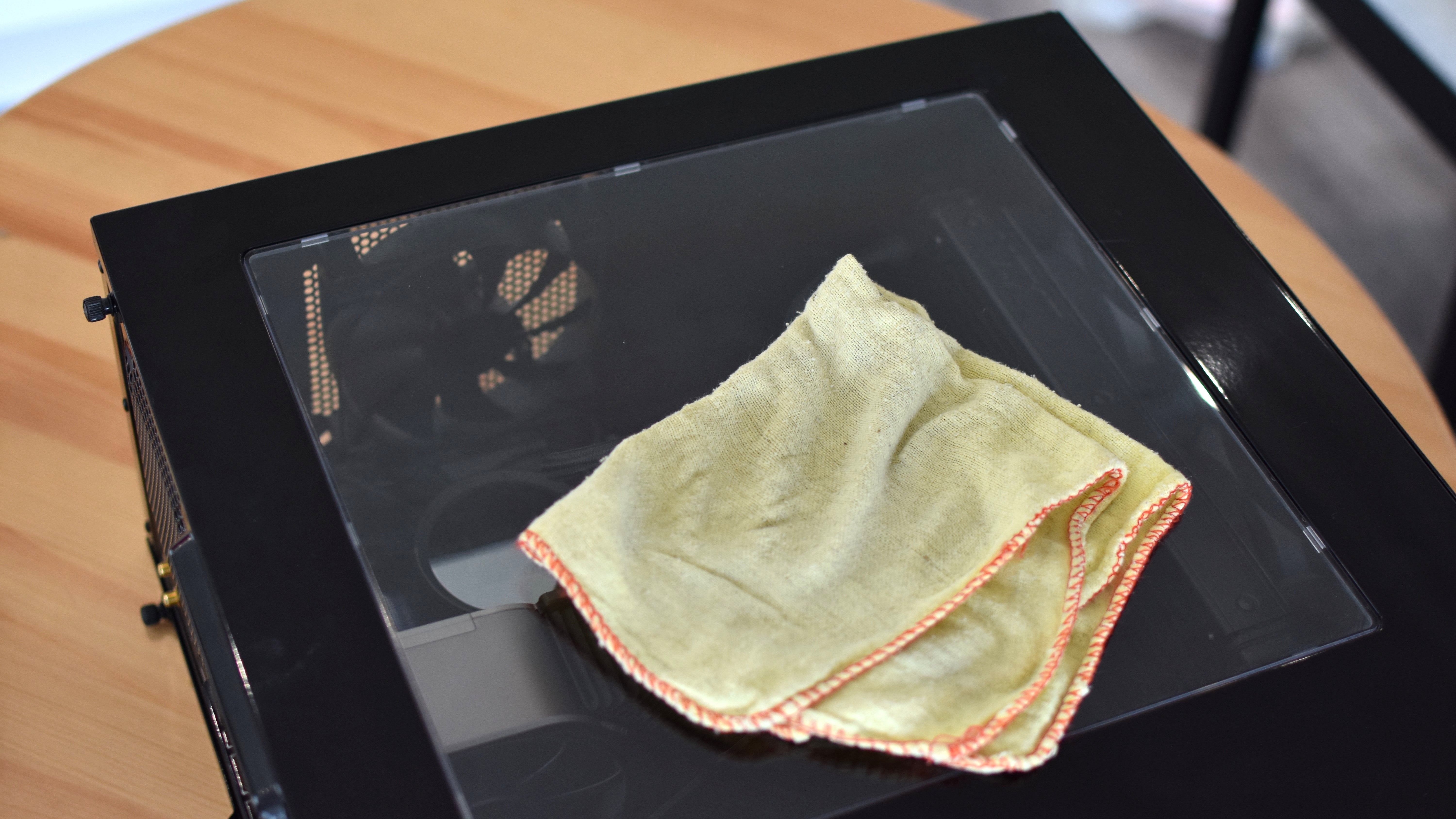 An image of a PC with a cleaning cloth on top of it.