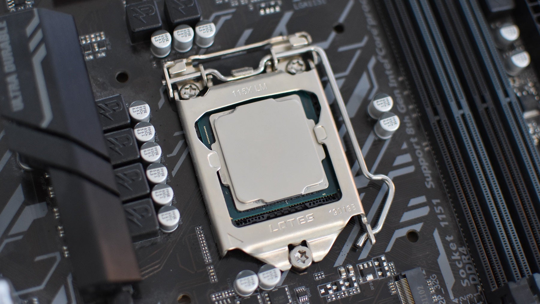 An Intel Core i7-8700K installed in a motherboard socket.