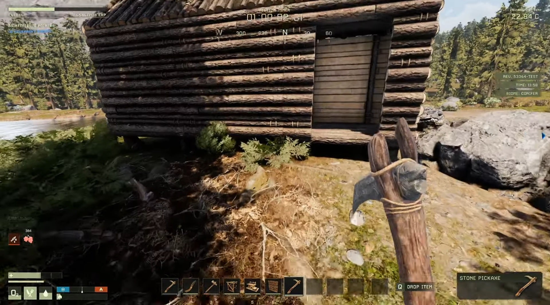 Icarus - In first person, the player holds a handmade stone axe while looking at a log cabin surrounded by woods.