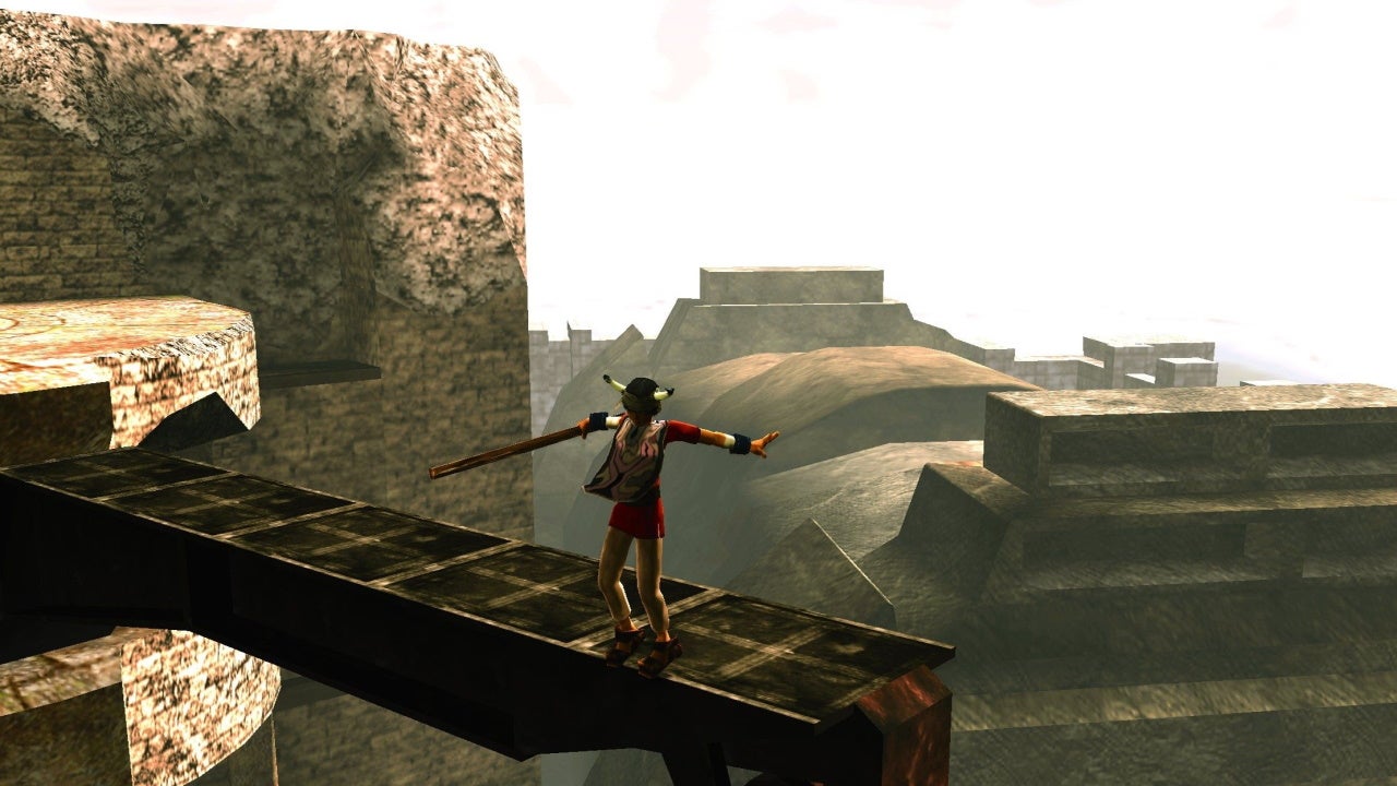 The player balances precariously on a beam in Ico.