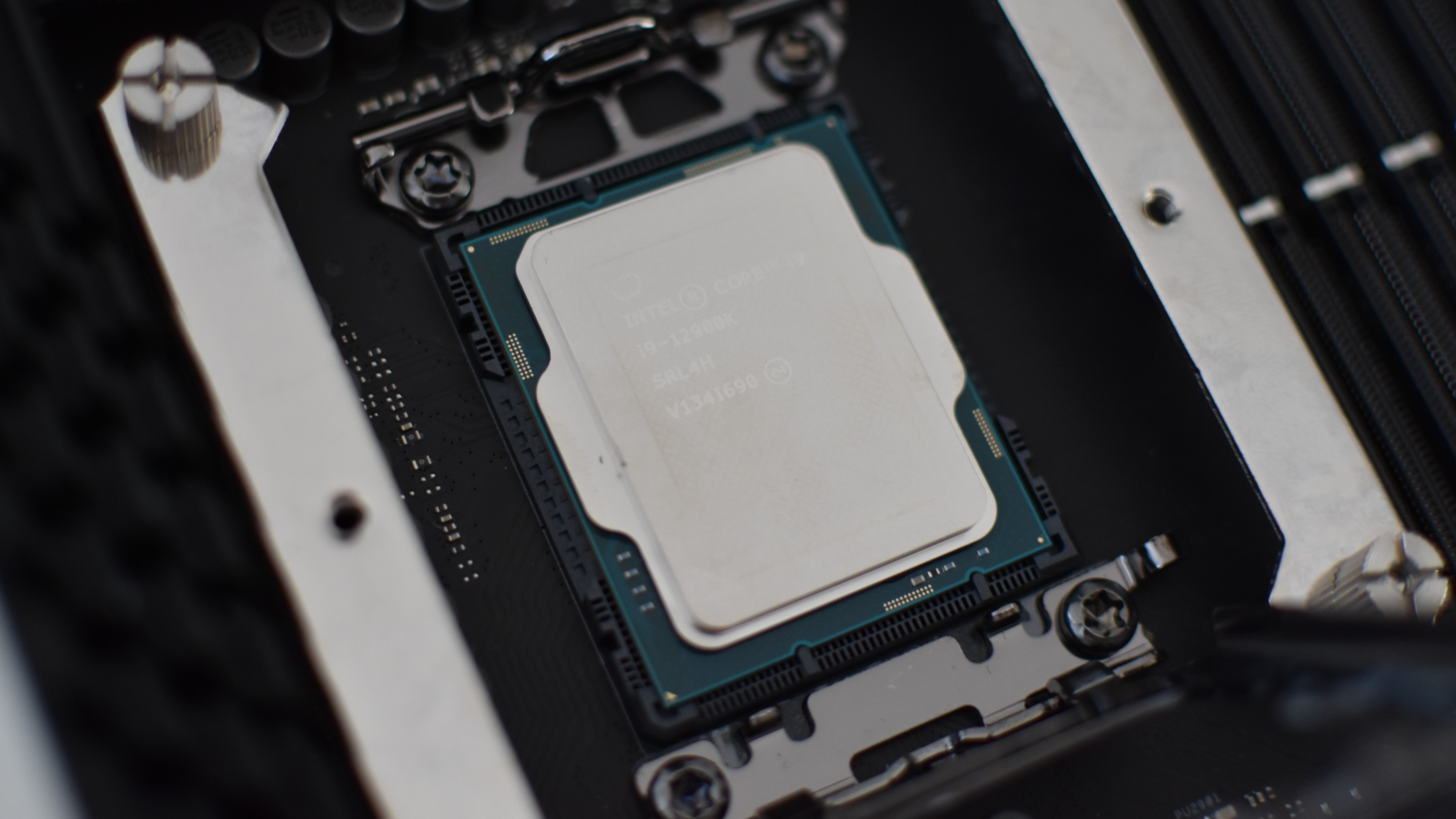 The Intel Core i9-12900K CPU installed in an LGA 1700 motherboard socket.