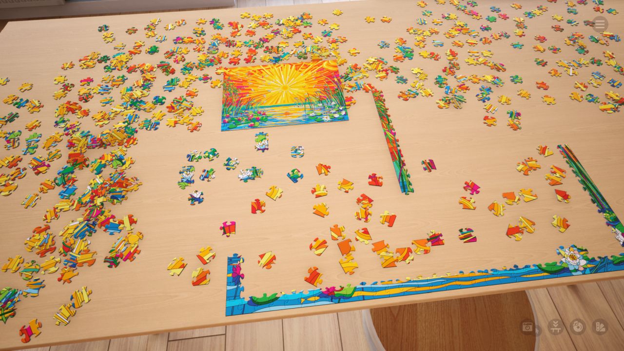 A virtual jigsaw of a sunset over water, laid out in pieces on a table in Jigsaw Puzzle Dreams