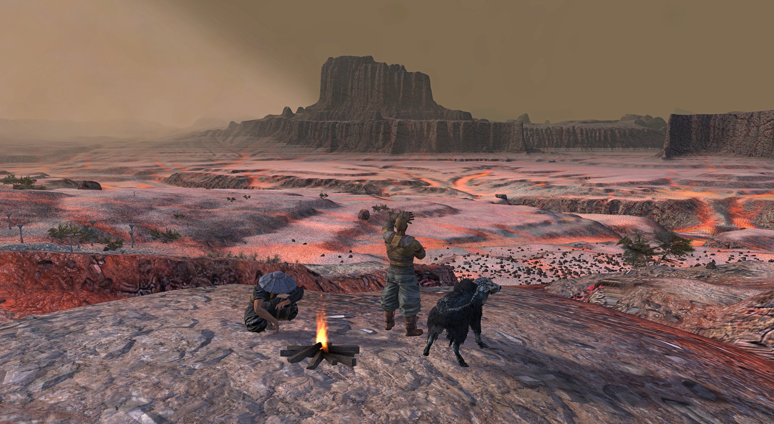 Two men and an alien goat gather round a campfire as they look out across a red, desert landscape in Kenshi