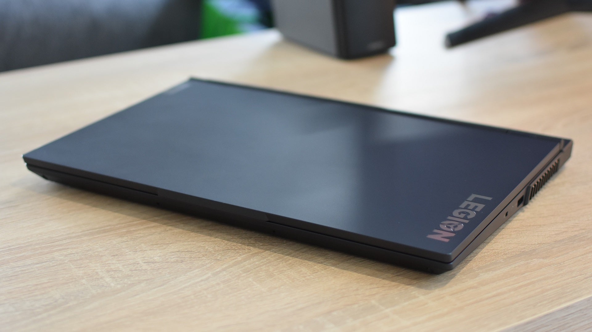 The Lenovo Legion 5 gaming laptop, closed and sat on a desk.