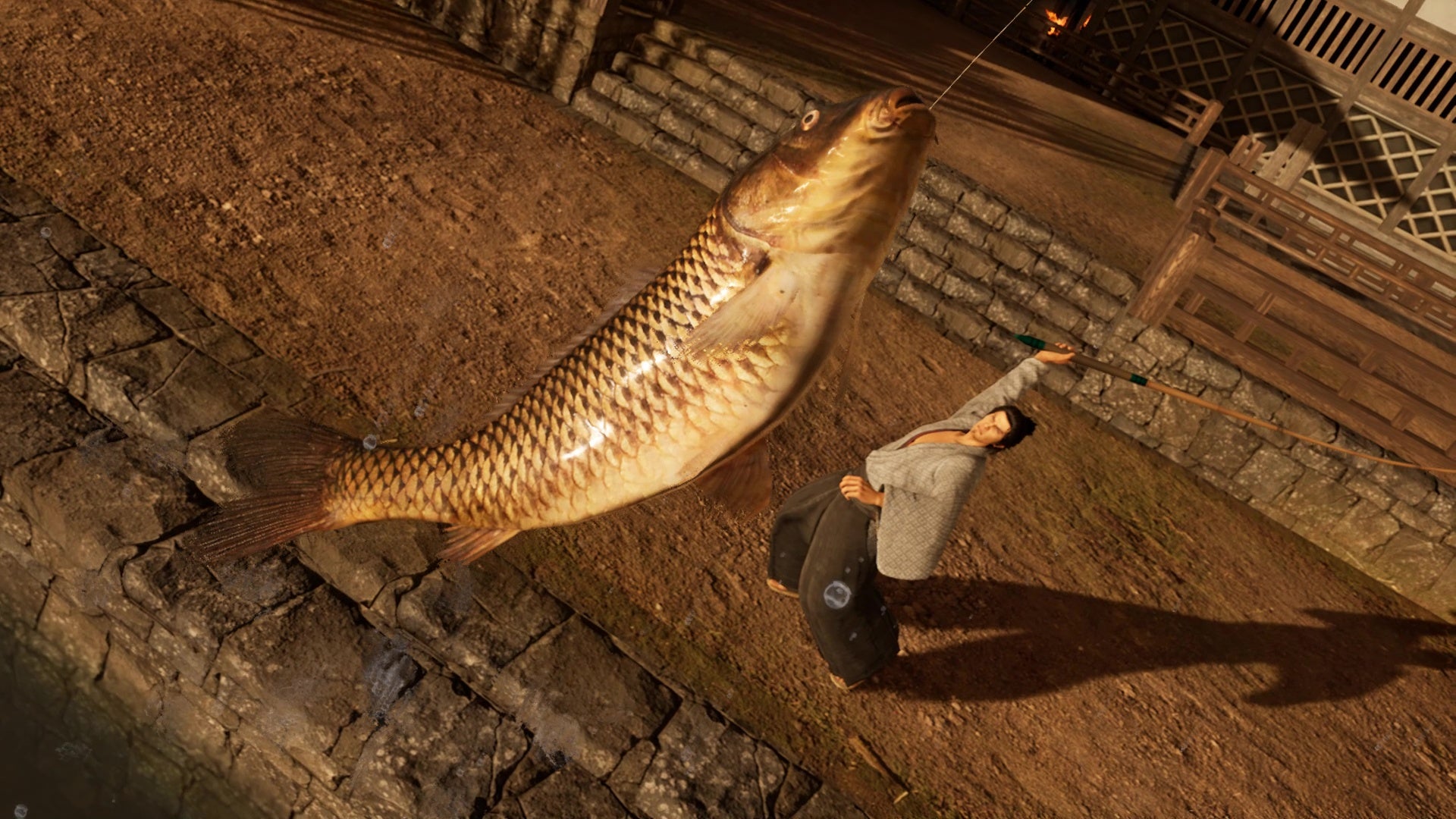 Ryoma catches a big fish in Like A Dragon Ishin!