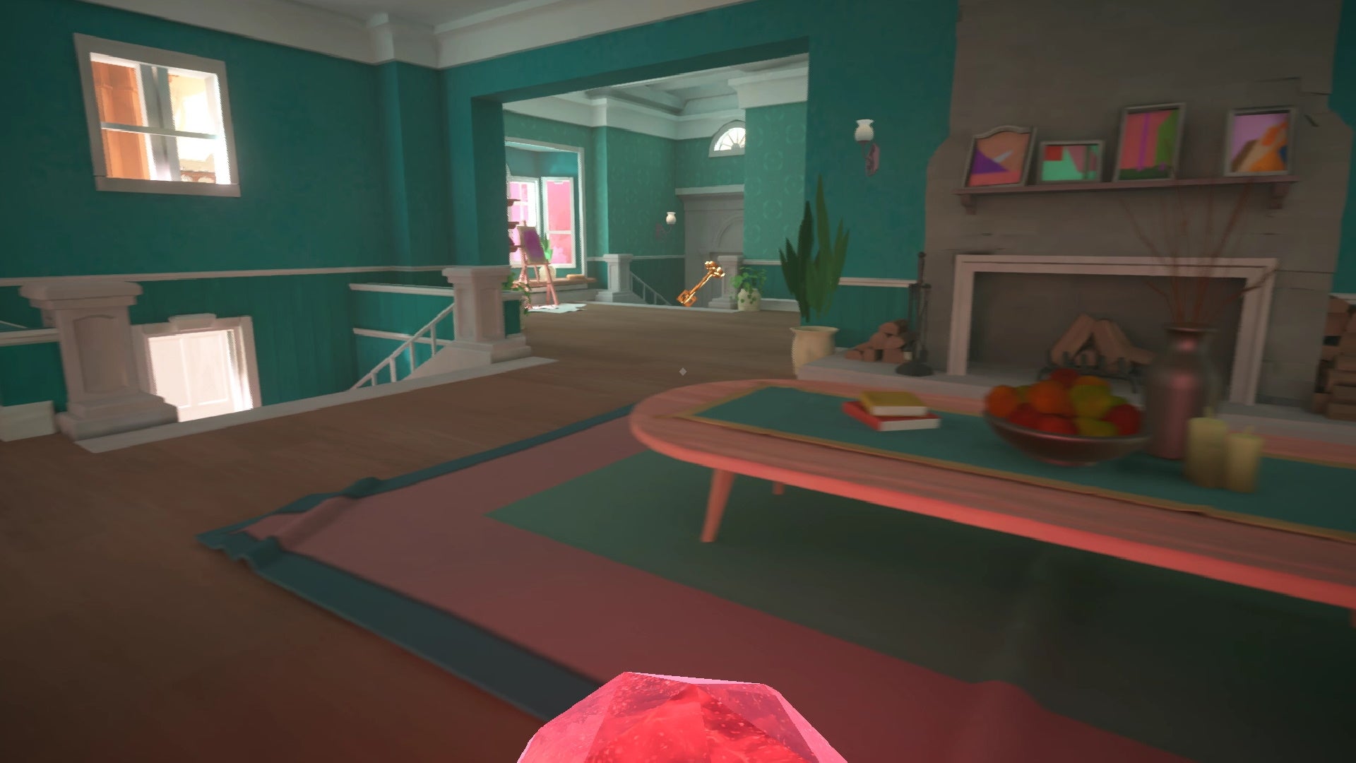 A screenshot of Maquette which shows me exploring a very green house. I have a red orb in my hand and there's a big key directly opposite me.